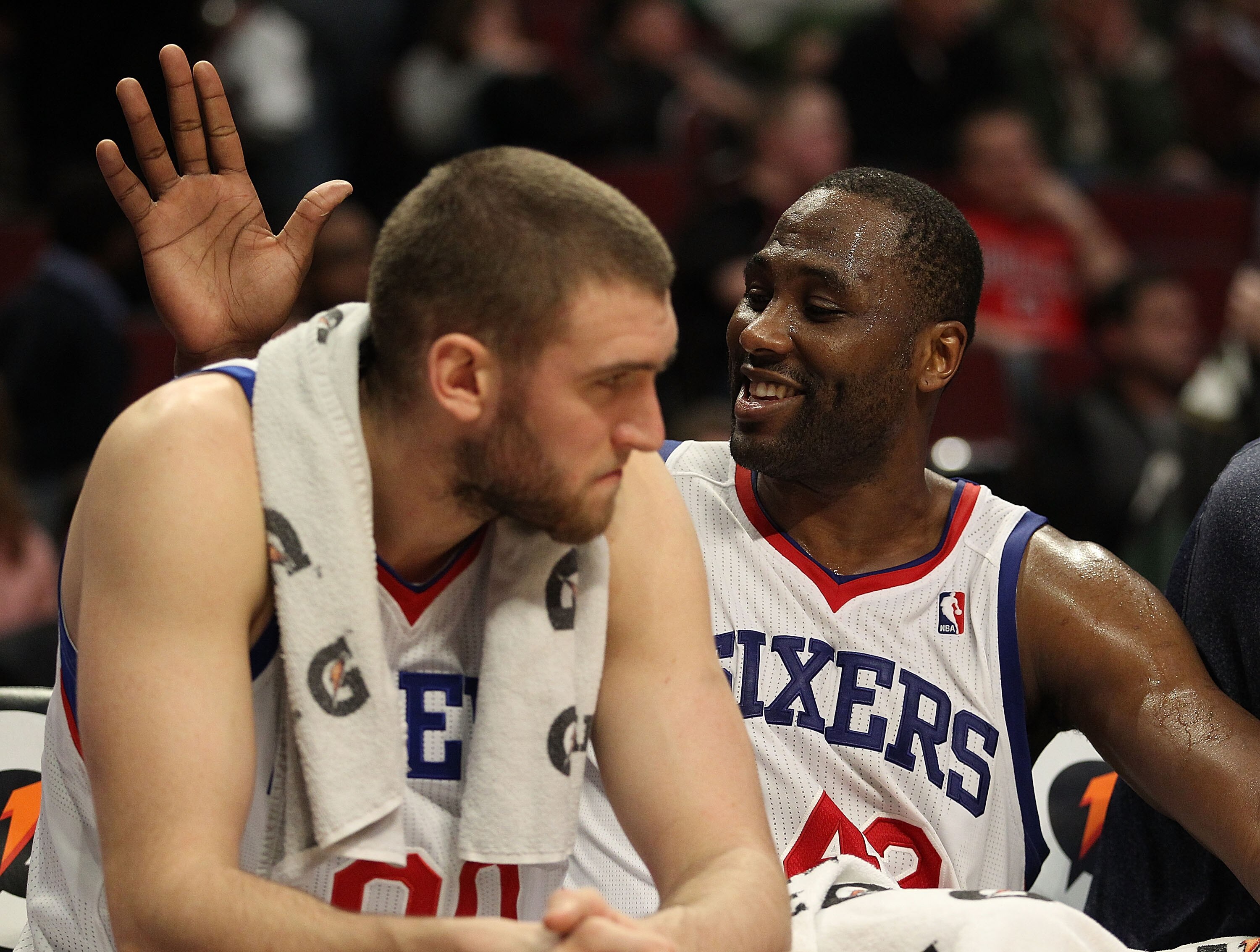 CHICAGO, IL - MARCH 28: Elton Brand #42 of the Philadelphia 76ers slaps teammate Spencer Hawes #00 on the back at the end of a win over the Chicago Bulls at the United Center on March 28, 2011 in Chicago, Illinois. The 76ers defeated the Bulls 97-85. NOTE