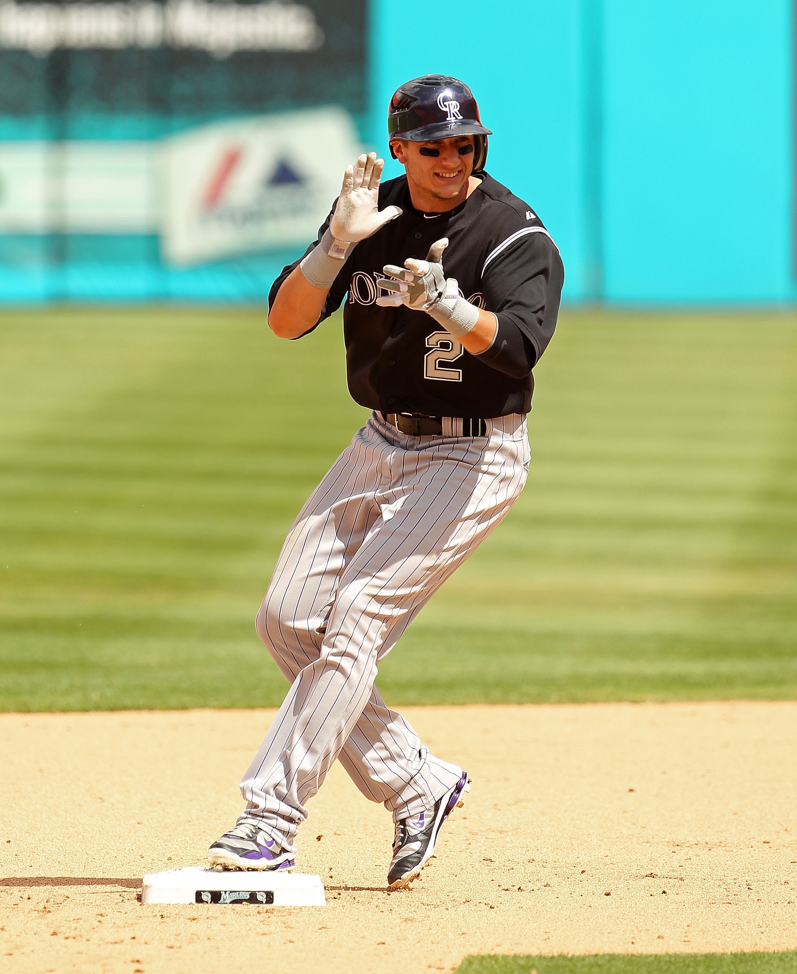 MIAMI GARDENS, FL - APRIL 24:  Troy Tulowitzki #2 of the Colorado Rockies reacts after hitting a 2 RBI double during a game against the Florida Marlins  at Sun Life Stadium on April 24, 2011 in Miami Gardens, Florida.  (Photo by Mike Ehrmann/Getty Images)