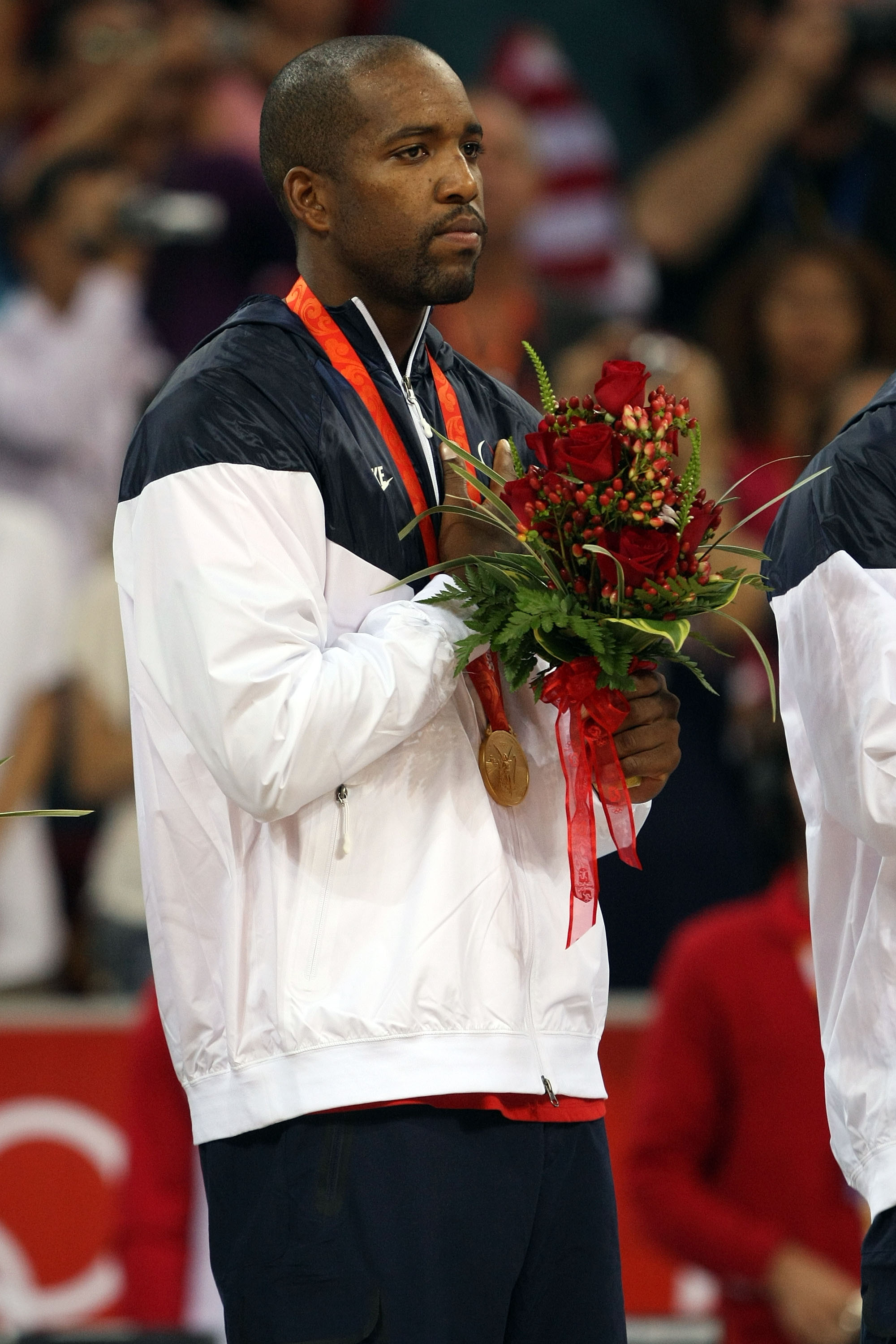 BEIJING - AUGUST 24:  Michael Redd #8 of the United States stands on the podium after winning the gold medal over Spain in the men's basketball final during Day 16 of the Beijing 2008 Olympic Games at the Beijing Olympic Basketball Gymnasium on August 24,