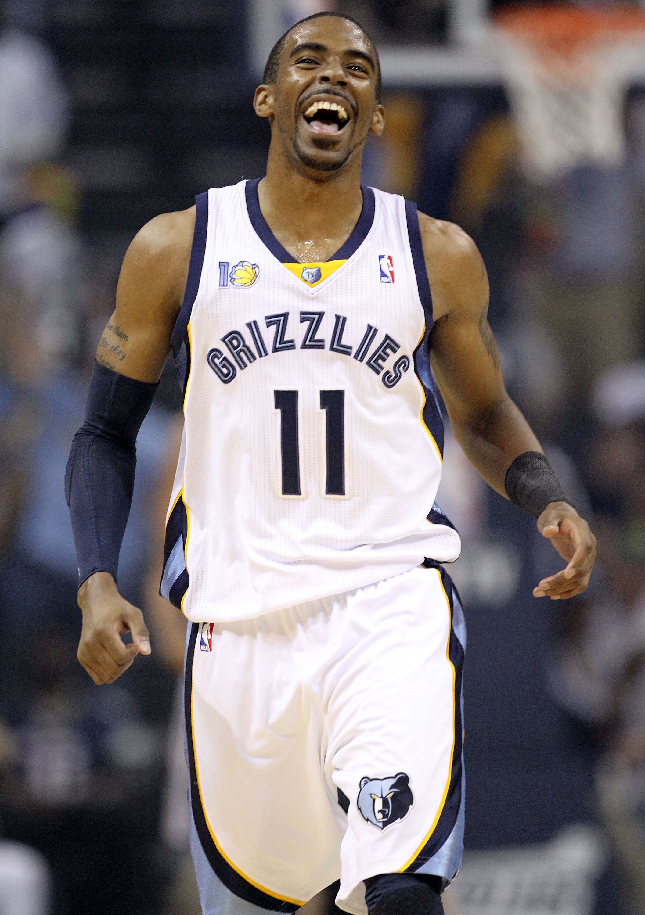 MEMPHIS, TN - APRIL 23:  Mike Conley #11 of the  Memphis Grizzles celebrates during the game against the San Antonio Spurs in Game three of the Western Conference Quarterfinals in the 2011 NBA Playoffs at FedExForum on April 23, 2011 in Memphis, Tennessee