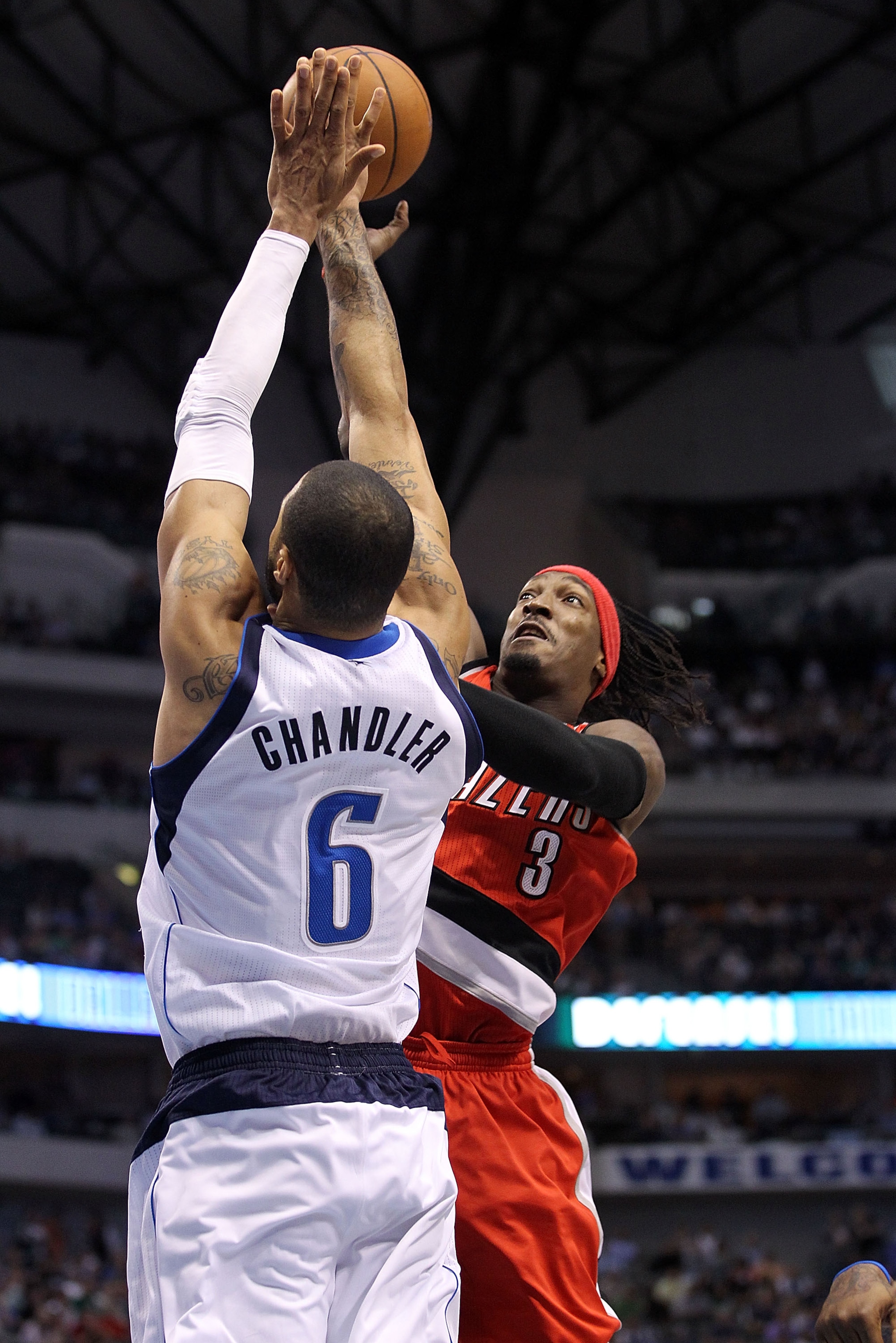 DALLAS, TX - APRIL 19:  Forward Gerald Wallace #3 of the Portland Trail Blazers takes a shot against Tyson Chandler #6 of the Dallas Mavericks in Game Two of the Western Conference Quarterfinals during the 2011 NBA Playoffs on April 19, 2011 at American A
