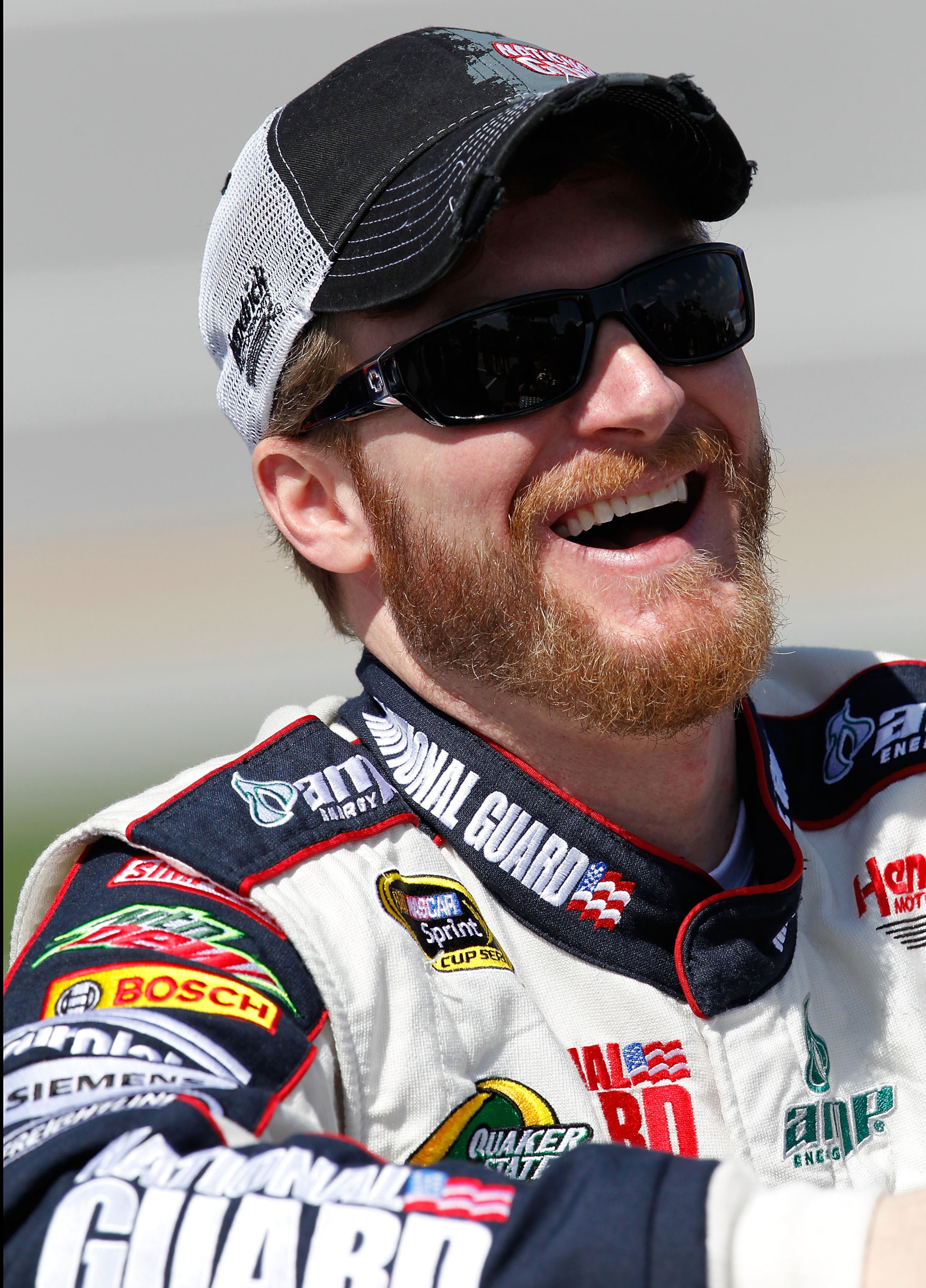 TALLADEGA, AL - APRIL 16:  Dale Earnhardt Jr., driver of the #88 National Guard/Amp Energy Chevrolet, stands next to his car on the grid during qualifying for the NASCAR Sprint Cup Series Aaron's 499 at Talladega Superspeedway on April 16, 2011 in Tallade