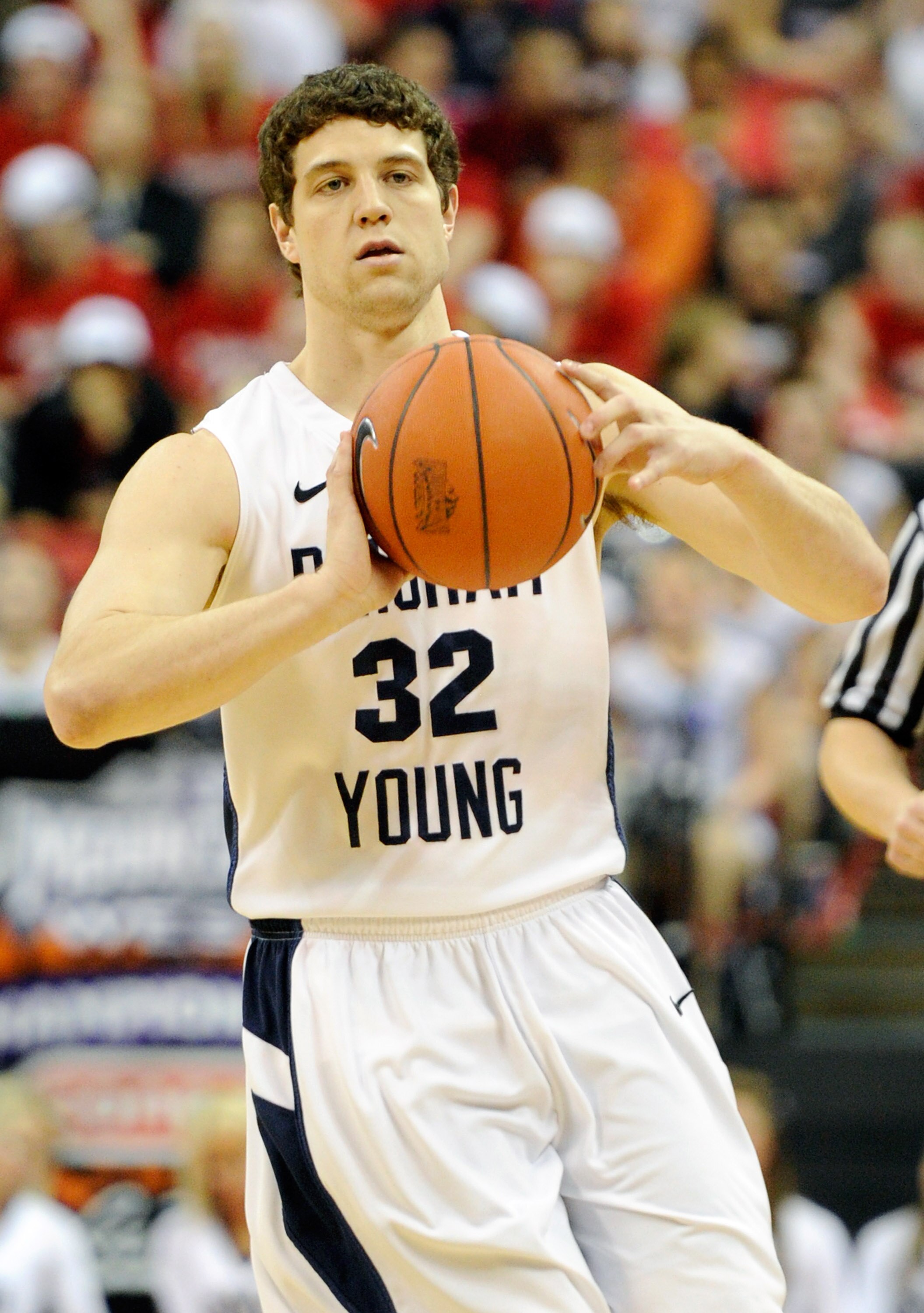 LAS VEGAS, NV - MARCH 12:  Jimmer Fredette #32 of the Brigham Young University Cougars passes the ball during the championship game of the Conoco Mountain West Conference Basketball tournament against the San Diego State Aztecs at the Thomas & Mack Center