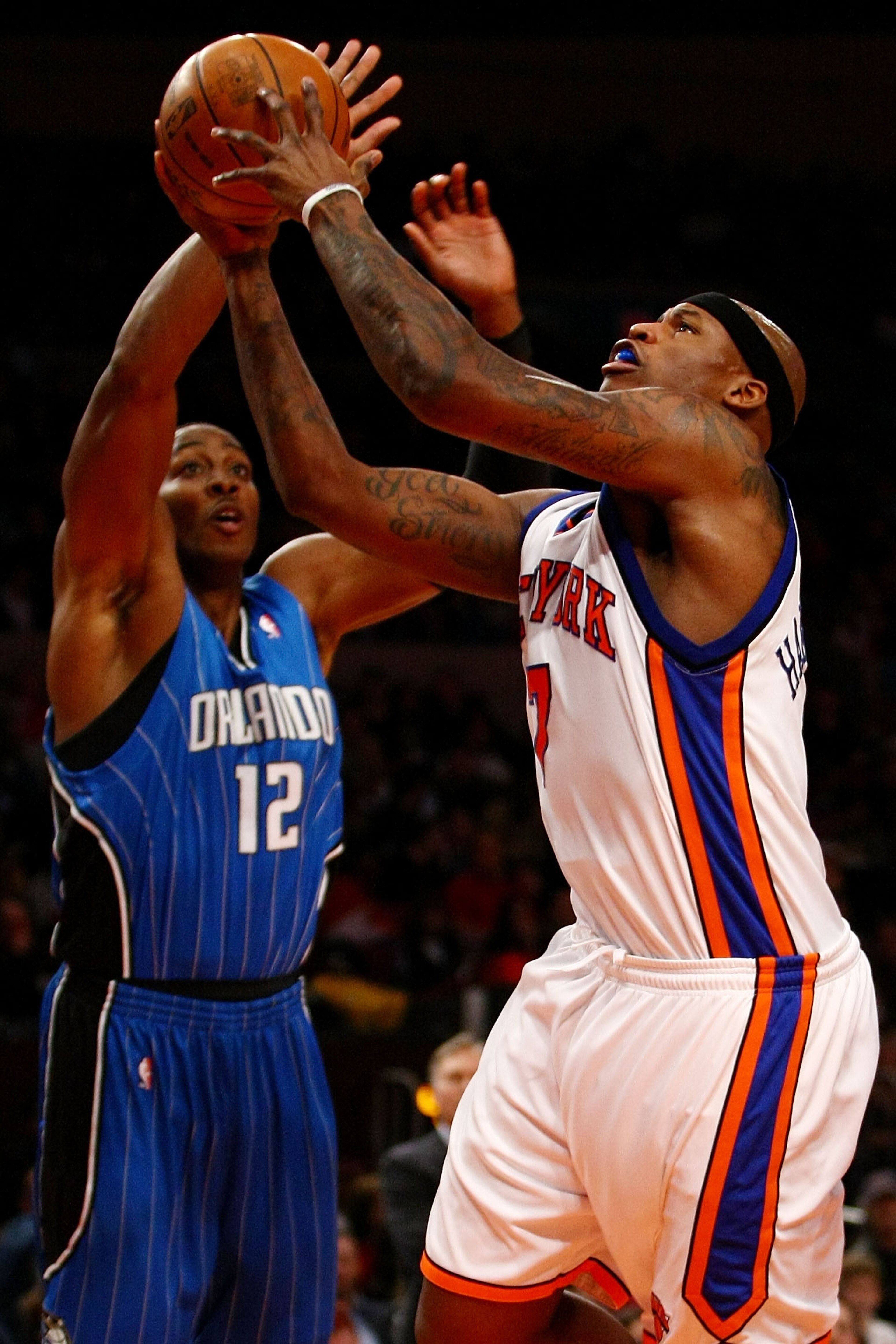 NEW YORK - NOVEMBER 29: Al Harrington #7 of the New York Knicks shoots over Dwight Howard #12 of the Orlando Magic at Madison Square Garden November 29, 2009 in New York City. NOTE TO USER: User expressly acknowledges and agrees that, by downloading and/o