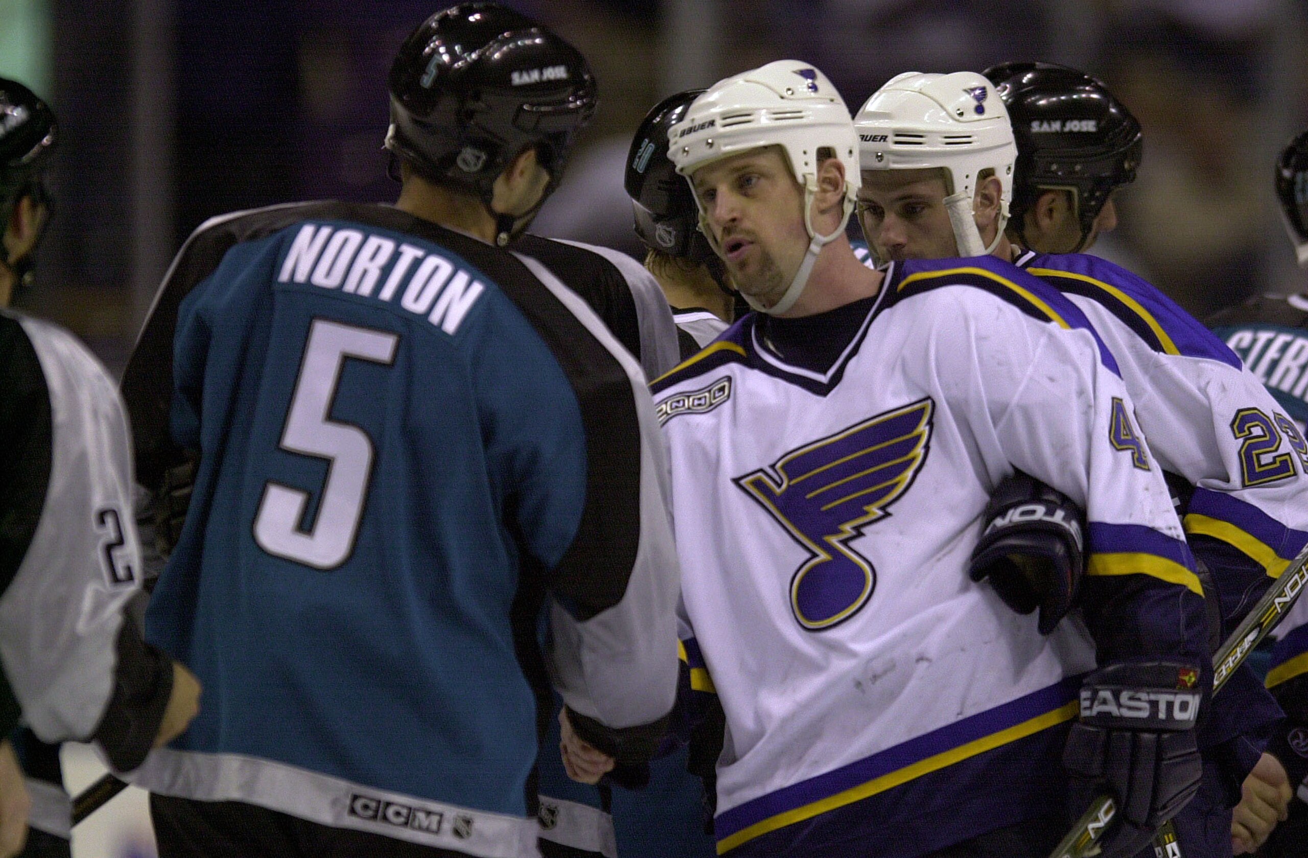 25 Apr 2000: Scott Young #48 of the St. Louis Blues shakes hands with Jeff Norton #5 of the San Jose Sharks at the end of the first round of the NHL Stanley Cup Playoffs at the Kiel Center in St. Louis, Missouri. The Sharks won 3-1and advance to the secon