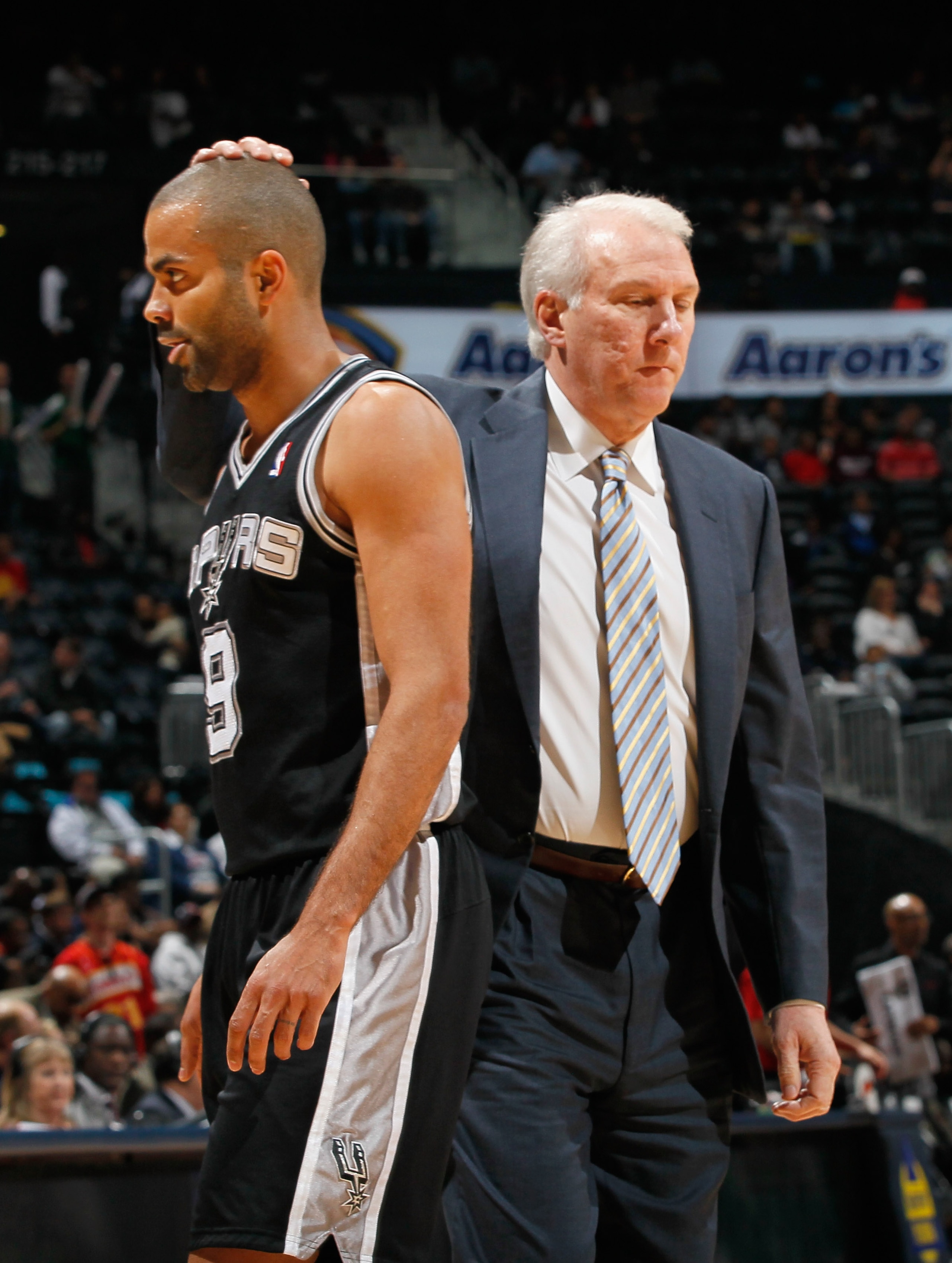 ATLANTA, GA - APRIL 05:  Tony Parker #9 and head coach Gregg Popovich of the San Antonio Spurs against the Atlanta Hawks at Philips Arena on April 5, 2011 in Atlanta, Georgia.  NOTE TO USER: User expressly acknowledges and agrees that, by downloading and/