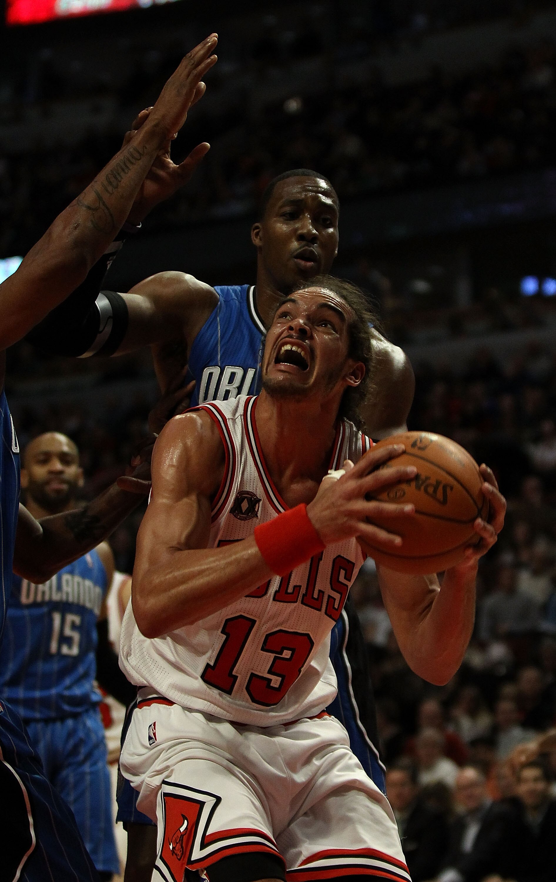 CHICAGO, IL - DECEMBER 01: Joakim Noah #13 of the Chicago Bulls goes up for a shot against Dwight Howard #12 of the Orlando Magic at the United Center on December 1, 2010 in Chicago, Illinois. The Magic defeated the Bulls 107-78. NOTE TO USER: User expres CHICAGO, IL - DECEMBER 01: Joakim Noah #13 of the Chicago Bulls goes up for a shot against Dwight Howard #12 of the Orlando Magic at the United Center on December 1, 2010 in Chicago, Illinois. The Magic defeated the Bulls 107-78. NOTE TO USER: User expres