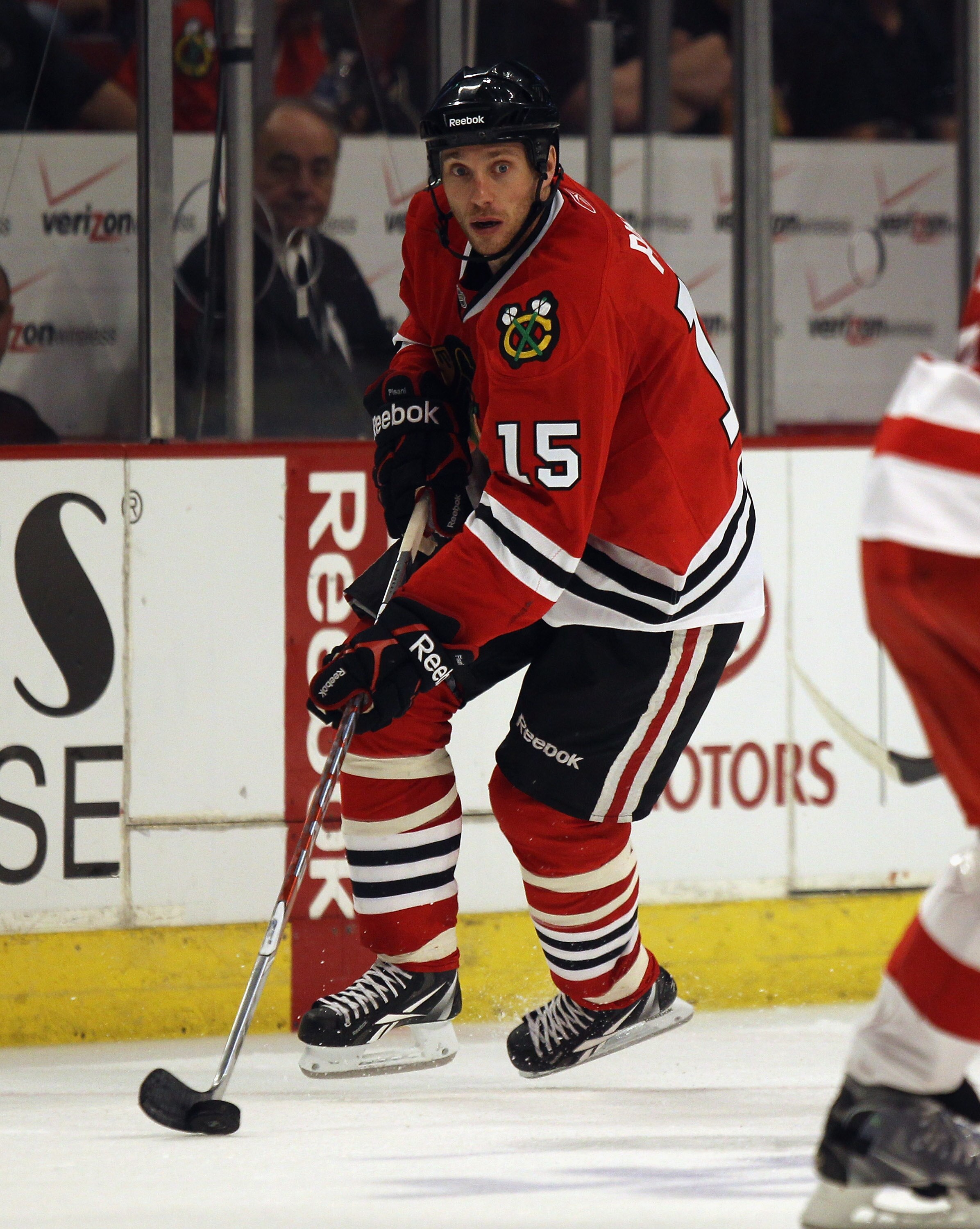 CHICAGO, IL - APRIL 10: Fernando Pisani #15 of the Chicago Blackhawks controls the puck against the Detroit Red Wings at the United Center on April 10, 2011 in Chicago, Illinois. The Red Wings defeated the Blackhawks 4-3. (Photo by Jonathan Daniel/Getty I