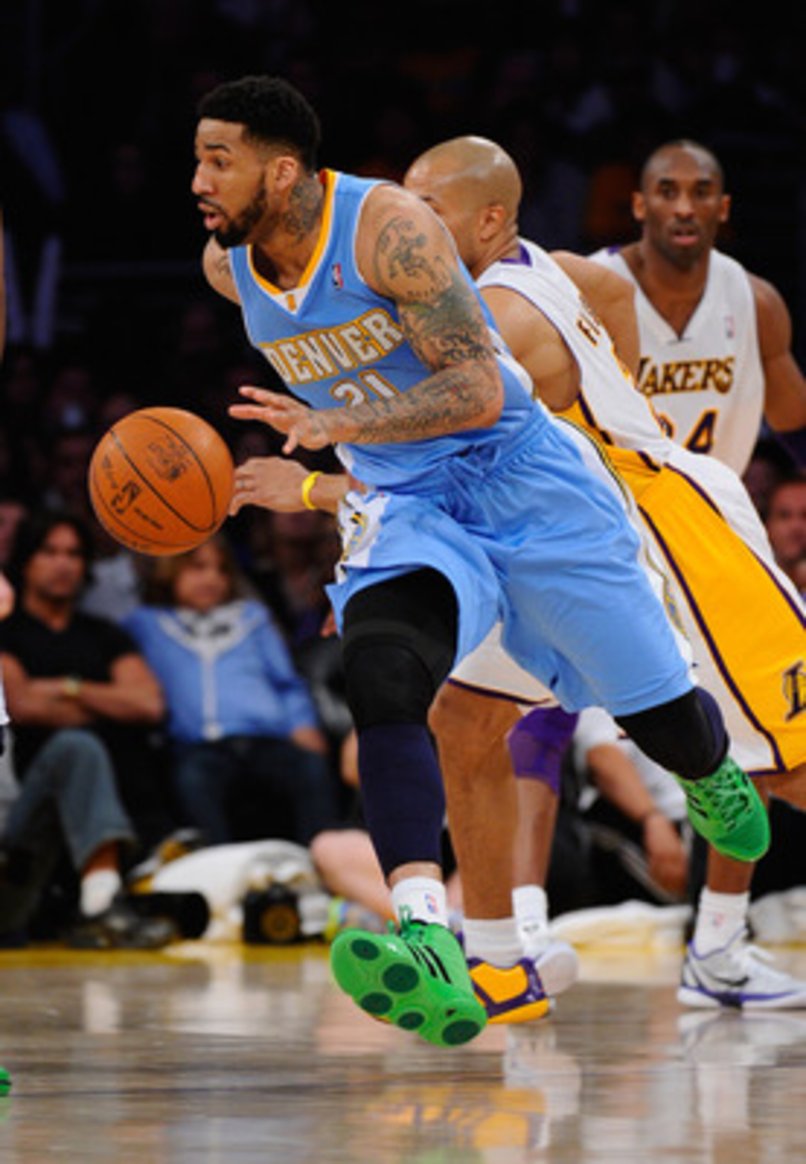 LOS ANGELES, CA - APRIL 03: Wilson Chandler #21 of the Denver Nuggets drives past Derek Fisher #2 of the Los Angeles Lakers during the game at Staples Center on April 3, 2011 in Los Angeles, California. NOTE TO USER: User expressly acknowledges and agree LOS ANGELES, CA - APRIL 03: Wilson Chandler #21 of the Denver Nuggets drives past Derek Fisher #2 of the Los Angeles Lakers during the game at Staples Center on April 3, 2011 in Los Angeles, California. NOTE TO USER: User expressly acknowledges and agree