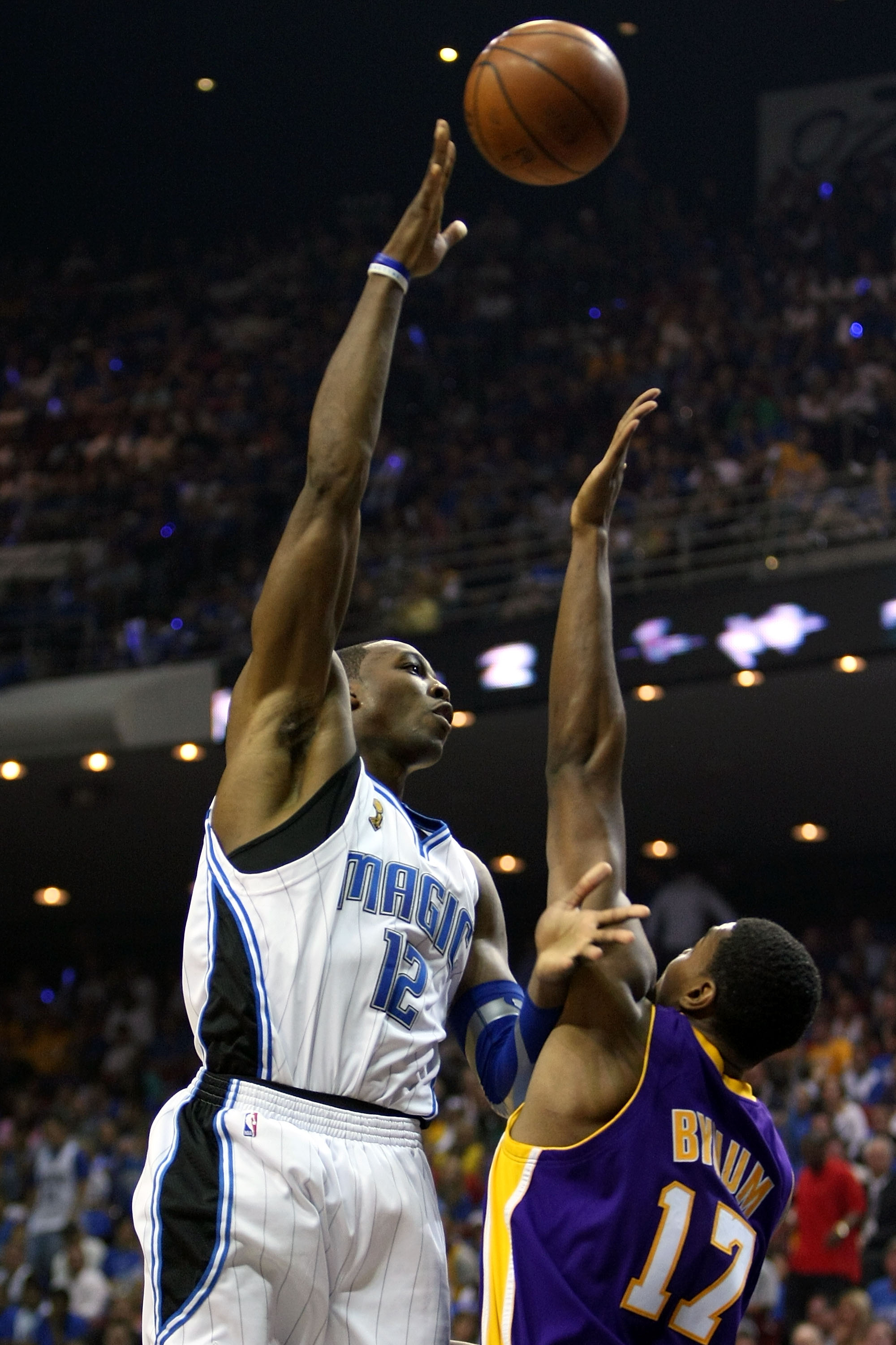 ORLANDO, FL - JUNE 14: Dwight Howard #12 of the Orlando Magic puts a shot up over Andrew Bynum #17 of the Los Angeles Lakers in Game Five of the 2009 NBA Finals on June 14, 2009 at Amway Arena in Orlando, Florida. NOTE TO USER: User expressly acknowled ORLANDO, FL - JUNE 14: Dwight Howard #12 of the Orlando Magic puts a shot up over Andrew Bynum #17 of the Los Angeles Lakers in Game Five of the 2009 NBA Finals on June 14, 2009 at Amway Arena in Orlando, Florida. NOTE TO USER: User expressly acknowled