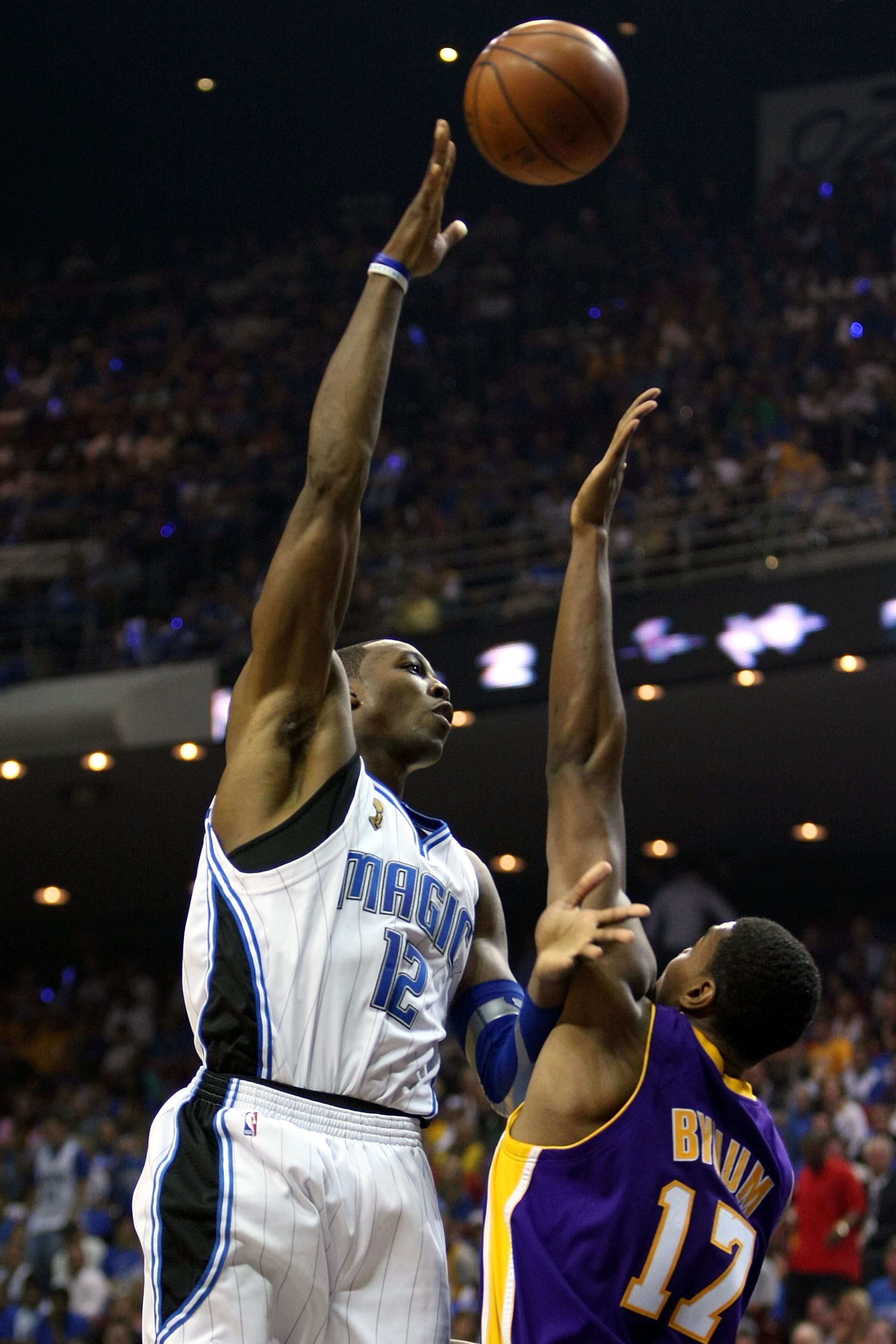 ORLANDO, FL - JUNE 14:  Dwight Howard #12 of the Orlando Magic puts a shot up over Andrew Bynum #17 of the Los Angeles Lakers in Game Five of the 2009 NBA Finals on June 14, 2009 at Amway Arena in Orlando, Florida.  NOTE TO USER:  User expressly acknowled