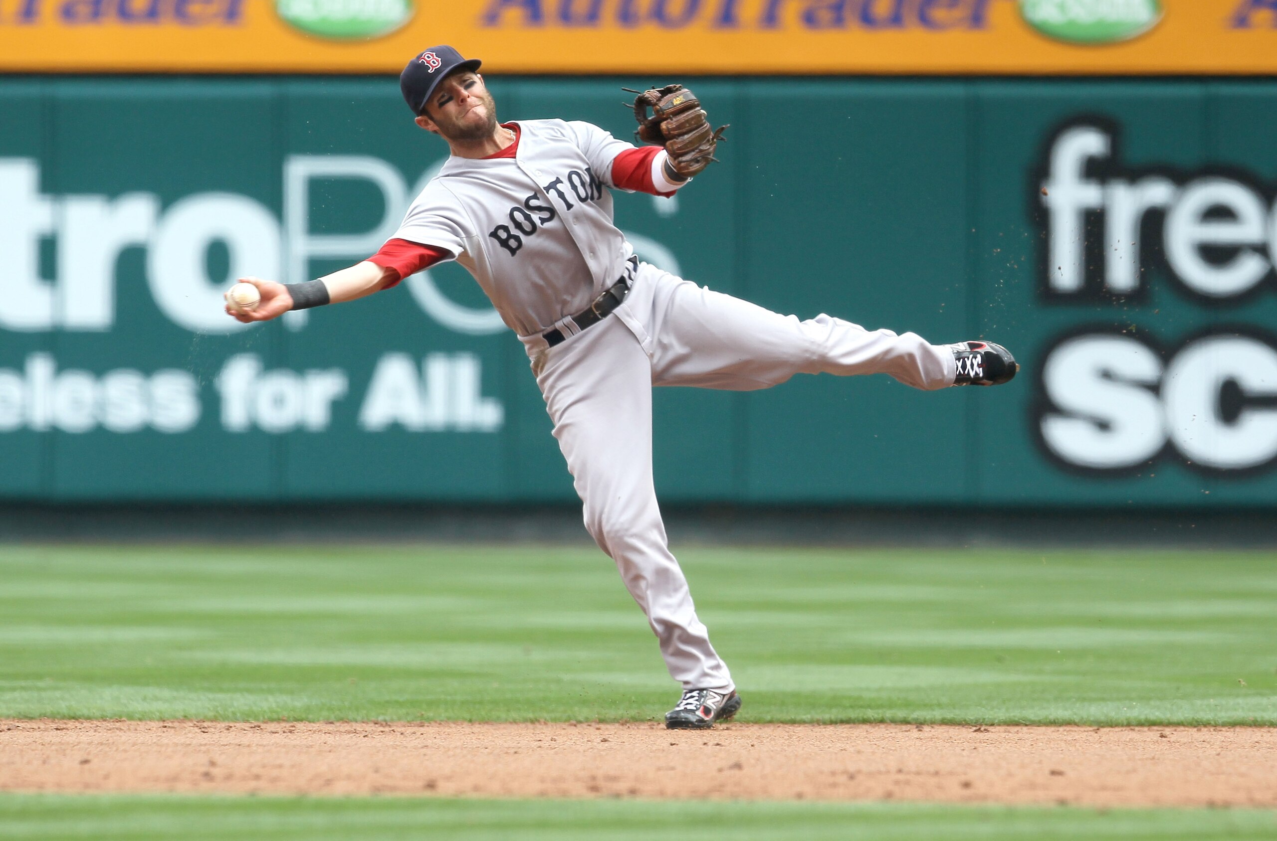 ANAHEIM, CA - APRIL 24: Second baseman Dustin Pedroia #15 of the Boston Red Sox throws to first but can't get Alberto Callaspo of the Los Angeles Angels of Anaheim on an infield single on April 24, 2011 at Angel Stadium in Anaheim, California. (Photo by ANAHEIM, CA - APRIL 24: Second baseman Dustin Pedroia #15 of the Boston Red Sox throws to first but can't get Alberto Callaspo of the Los Angeles Angels of Anaheim on an infield single on April 24, 2011 at Angel Stadium in Anaheim, California. (Photo by
