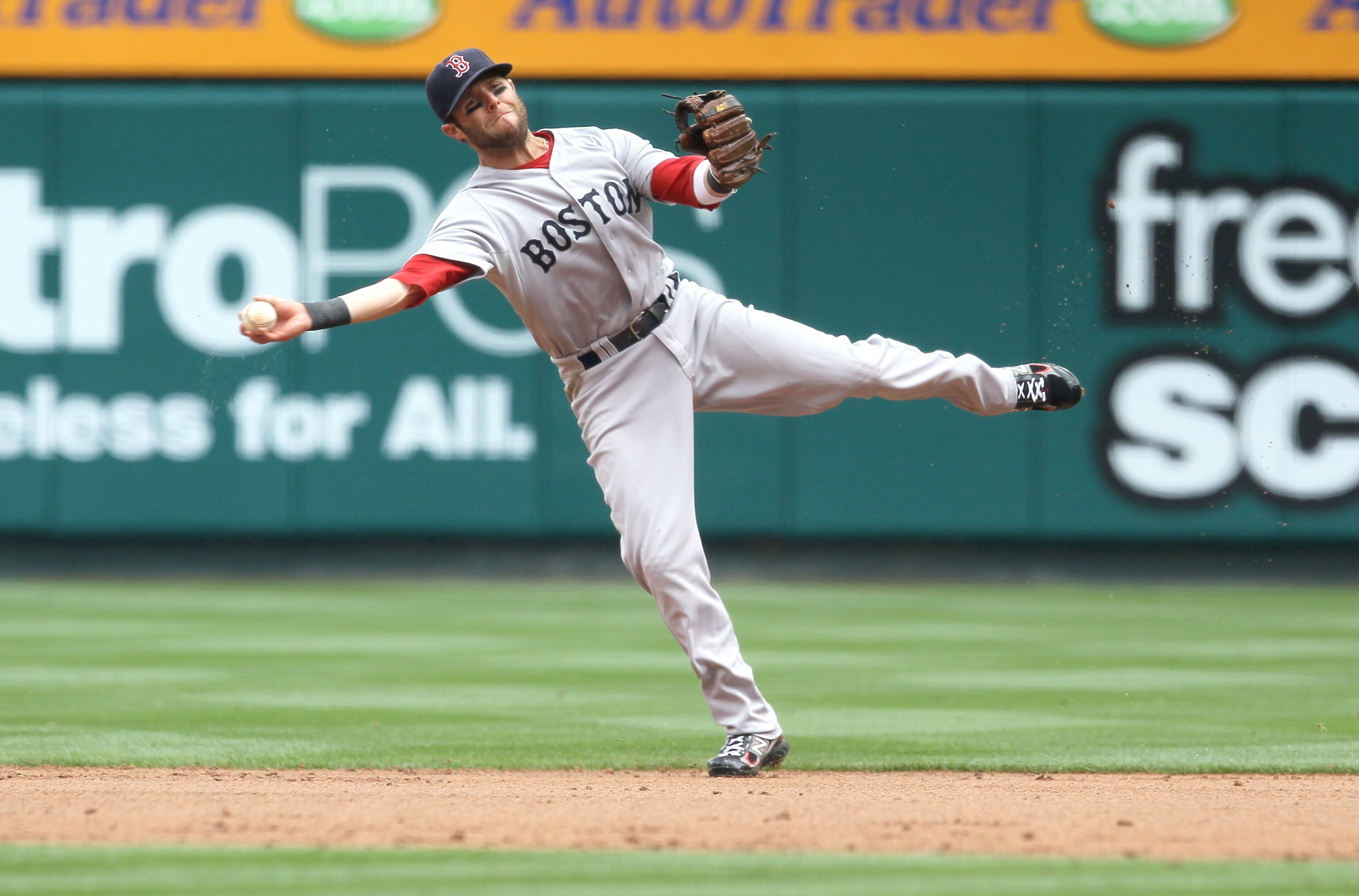 ANAHEIM, CA - APRIL 24: Second baseman Dustin Pedroia #15 of the Boston Red Sox throws to first but can't get Alberto Callaspo of the Los Angeles Angels of Anaheim on an infield single on April 24, 2011 at Angel Stadium in Anaheim, California. (Photo by ANAHEIM, CA - APRIL 24: Second baseman Dustin Pedroia #15 of the Boston Red Sox throws to first but can't get Alberto Callaspo of the Los Angeles Angels of Anaheim on an infield single on April 24, 2011 at Angel Stadium in Anaheim, California. (Photo by