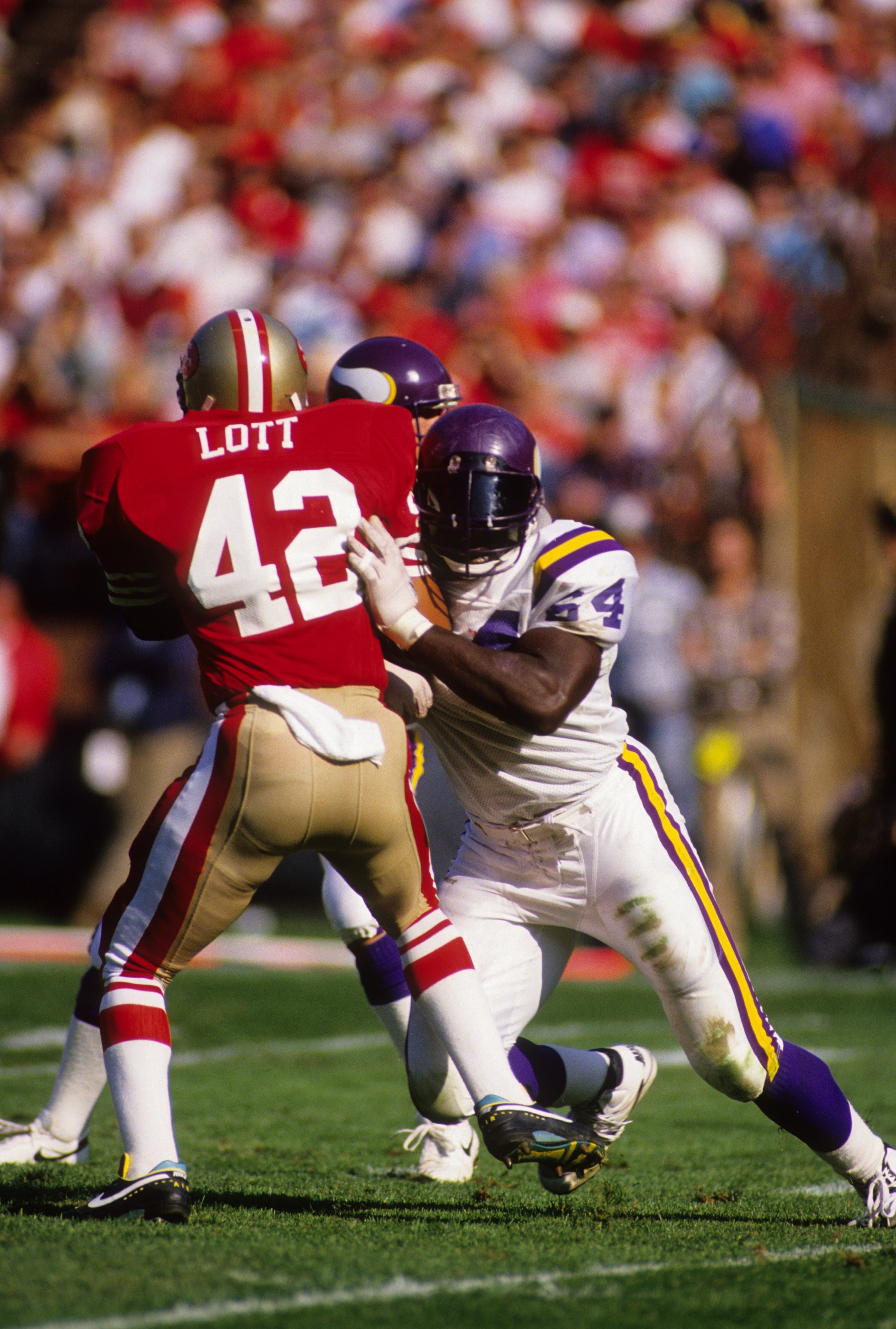 SAN FRANCISCO - OCTOBER 30:  Guard Randall McDaniel #64 of the Minnesota Vikings blocks safety Ronnie Lott #42 of the San Francisco 49ers during the game at Candlestick Park on October 30, 1988 in San Francisco, California.  The 49er won 24-21.  (Photo by