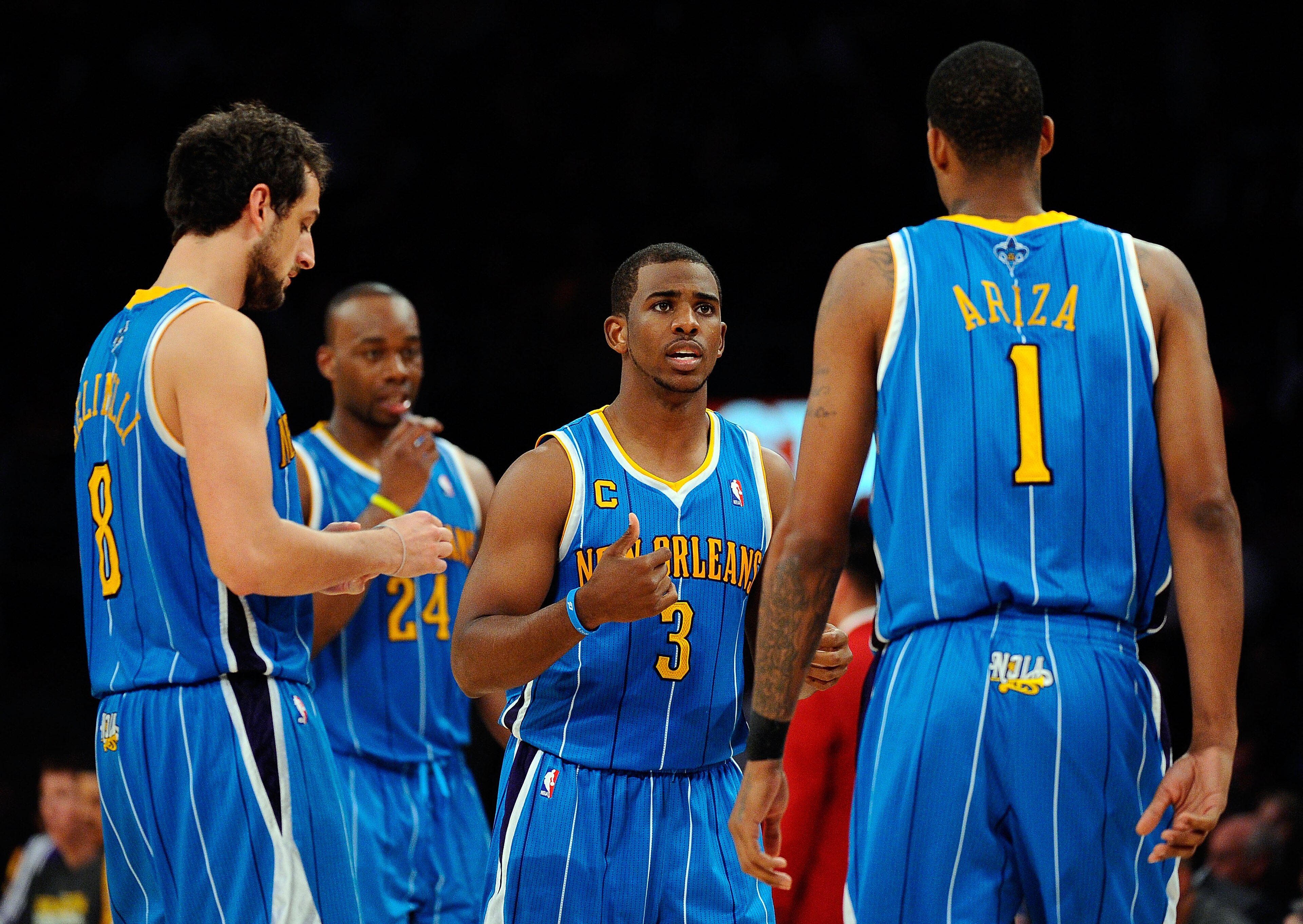 LOS ANGELES, CA - APRIL 20: (C) Chris Paul #3 of the New Orleans Hornets talks with teammates Marco Belinelli #8 and Trevor Ariza #1 while taking on the Los Angeles Lakers in Game Two of the Western Conference Quarterfinals in the 2011 NBA Playoffs on Ap LOS ANGELES, CA - APRIL 20: (C) Chris Paul #3 of the New Orleans Hornets talks with teammates Marco Belinelli #8 and Trevor Ariza #1 while taking on the Los Angeles Lakers in Game Two of the Western Conference Quarterfinals in the 2011 NBA Playoffs on Ap