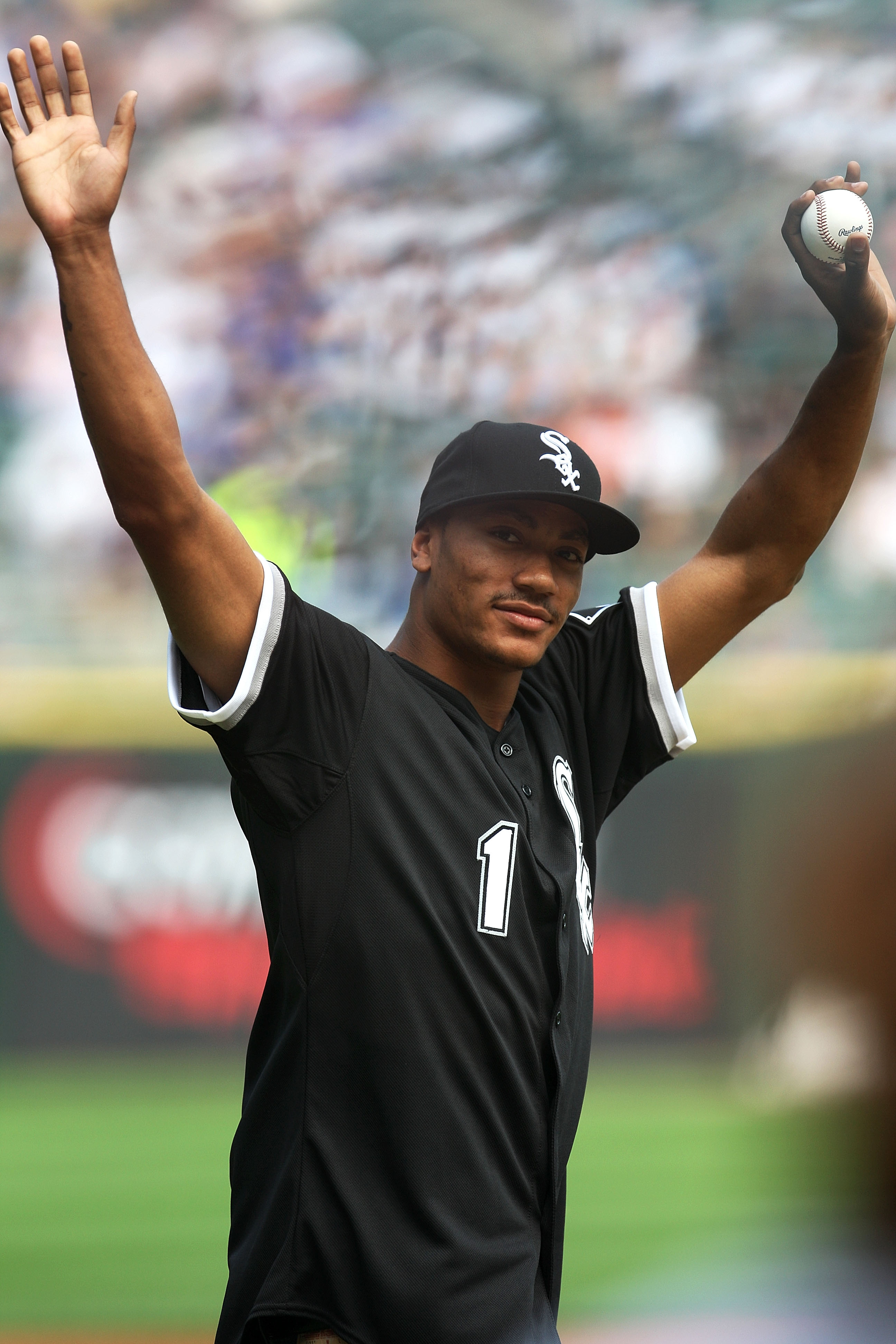 CHICAGO - JUNE 27:  Derrick Rose, number 1 overall pick in the 2008 NBA Draft by the Chicago Bulls, acknowledges the fans as he walks towards the mound to throw out the ceremonial first pitch prior to the MLB Interleague game between the Chicago Cubs and
