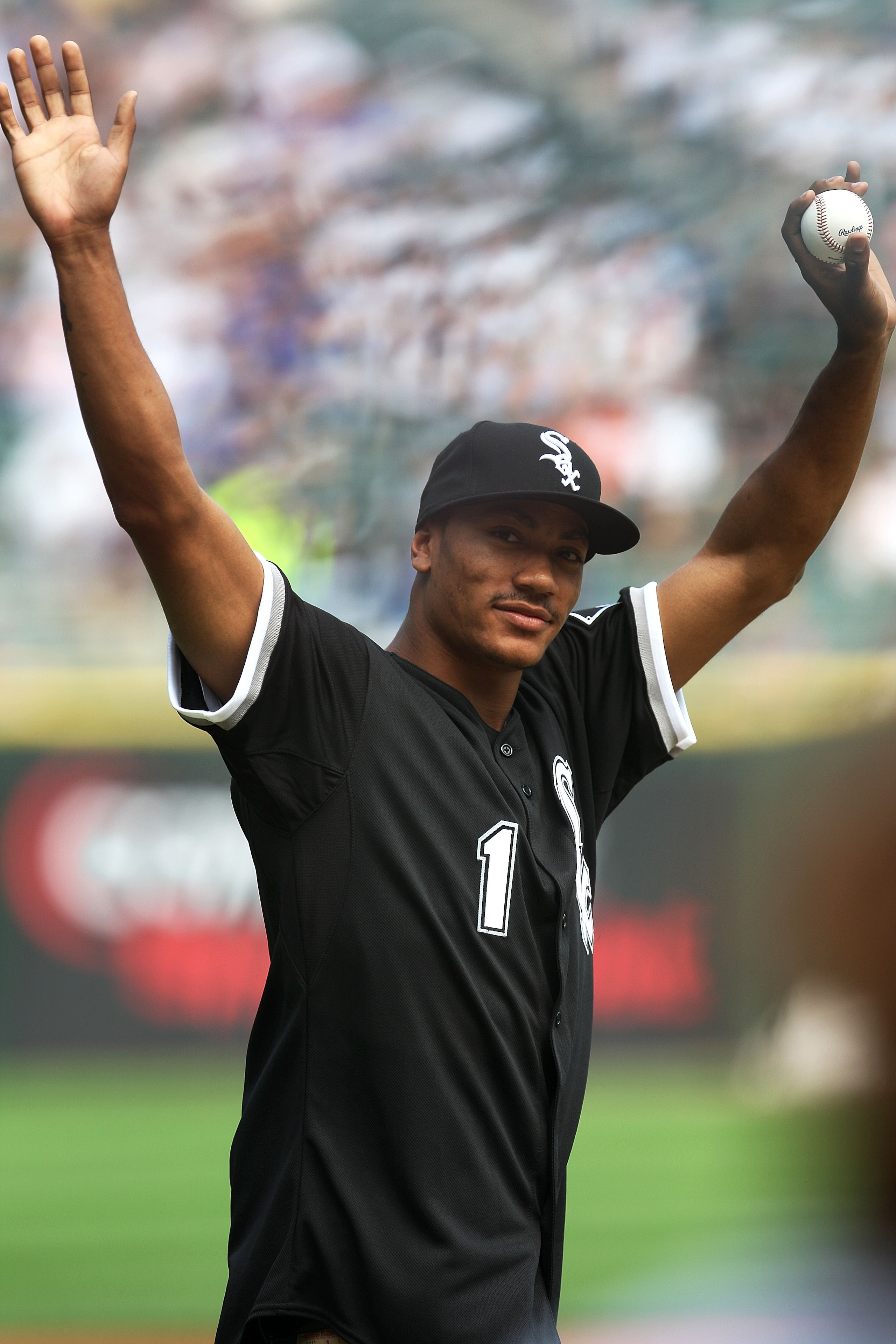 CHICAGO - JUNE 27: Derrick Rose, number 1 overall pick in the 2008 NBA Draft by the Chicago Bulls, acknowledges the fans as he walks towards the mound to throw out the ceremonial first pitch prior to the MLB Interleague game between the Chicago Cubs and CHICAGO - JUNE 27: Derrick Rose, number 1 overall pick in the 2008 NBA Draft by the Chicago Bulls, acknowledges the fans as he walks towards the mound to throw out the ceremonial first pitch prior to the MLB Interleague game between the Chicago Cubs and