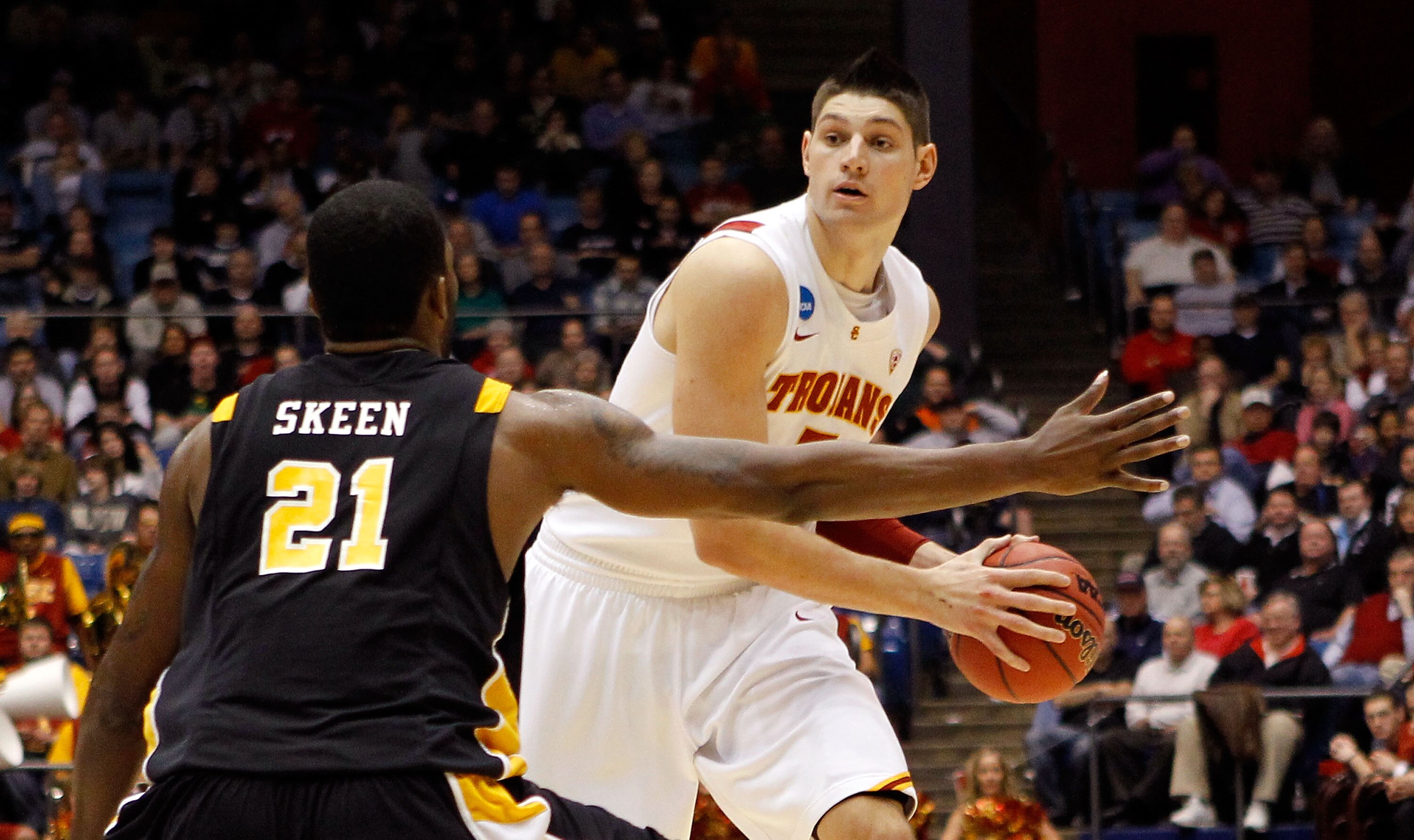 DAYTON, OH - MARCH 16: Nikola Vucevic #5 of the USC Trojans handles the ball against Jamie Skeen #21 of the Virginia Commonwealth Rams during the first round of the 2011 NCAA men's basketball tournament at UD Arena on March 16, 2011 in Dayton, Ohio.  (Pho