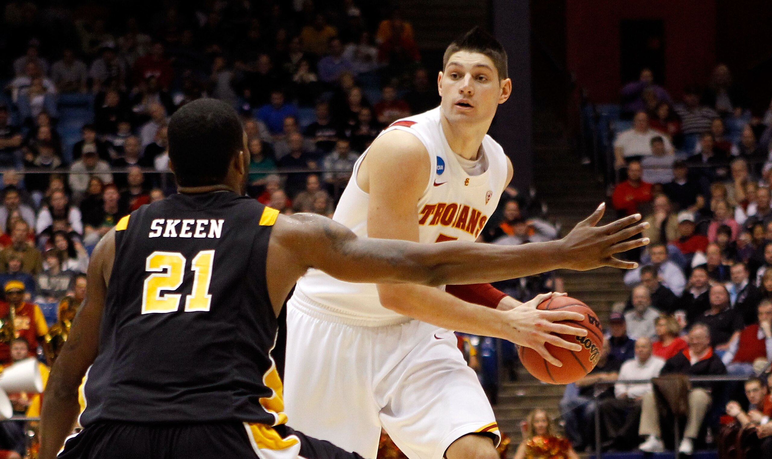 DAYTON, OH - MARCH 16: Nikola Vucevic #5 of the USC Trojans handles the ball against Jamie Skeen #21 of the Virginia Commonwealth Rams during the first round of the 2011 NCAA men's basketball tournament at UD Arena on March 16, 2011 in Dayton, Ohio.  (Pho