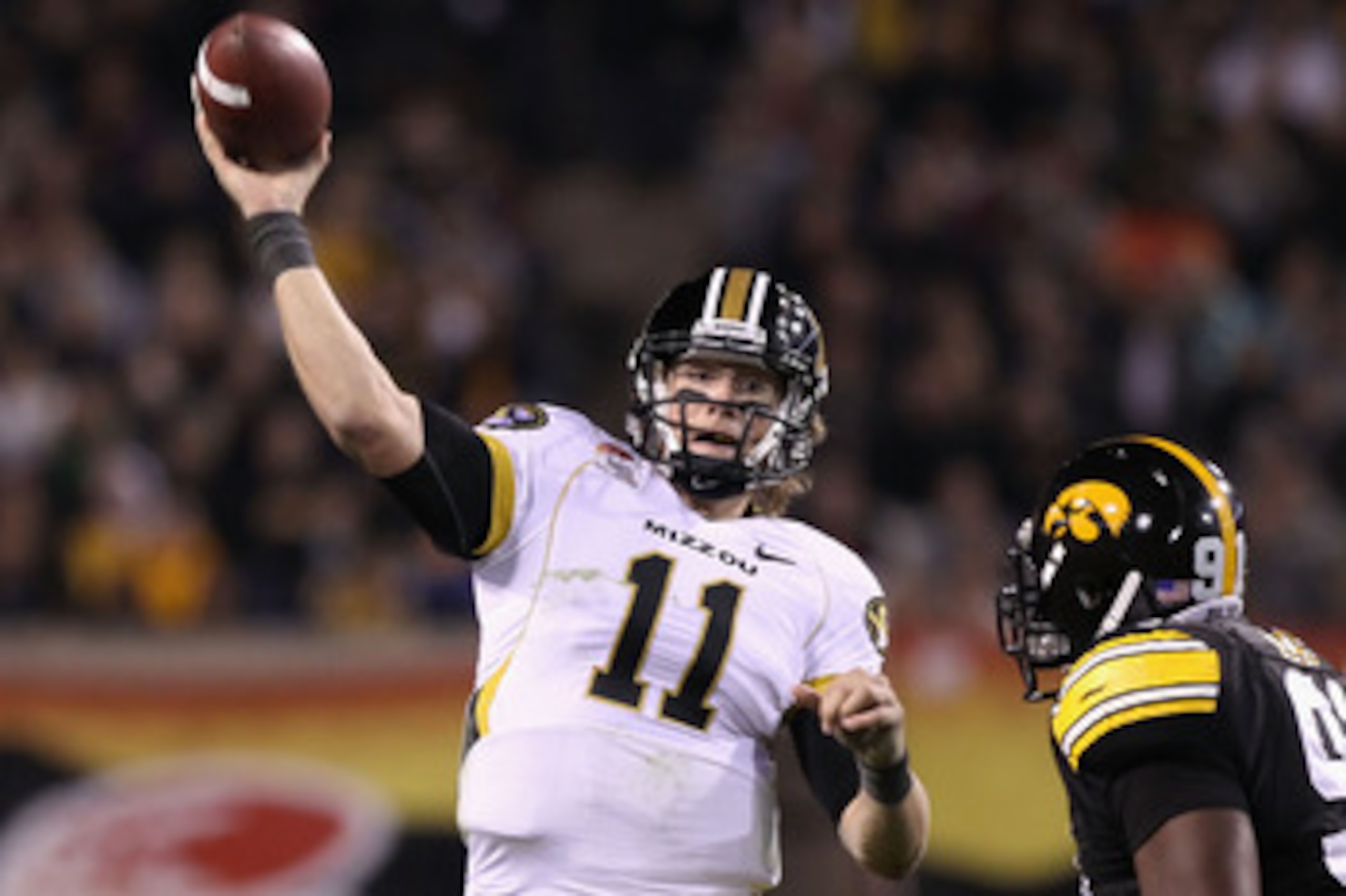 TEMPE, AZ - DECEMBER 28:  Quarterback Blaine Gabbert #11 of the Missouri Tigers throws a pass during the Insight Bowl against the Iowa Hawkeyes at Sun Devil Stadium on December 28, 2010 in Tempe, Arizona.  The Hawkeyes defeated the Tigers 27-24. (Photo by