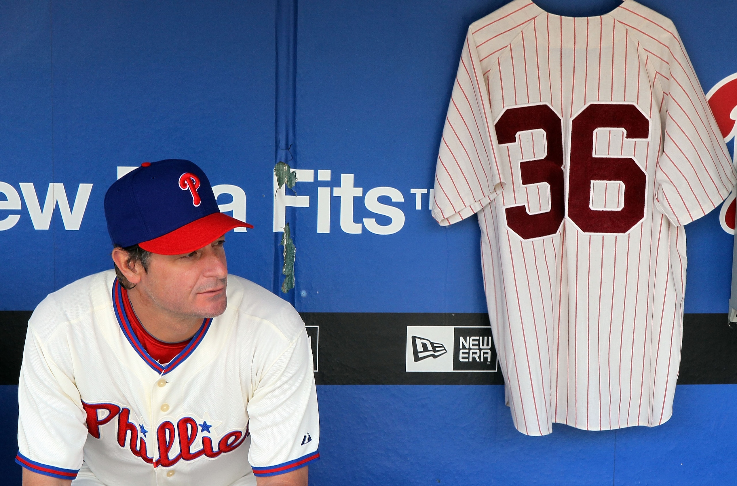 PHILADELPHIA - MAY 06:  Jamie Moyer #50 of the Philadelphia Phillies sits in the dugout next to a jersey of Phillies Hall of Fame pitcher Robin Roberts prior to playing the St. Louis Cardinals at Citizens Bank Park on May 6, 2010 in Philadelphia, Pennsylv