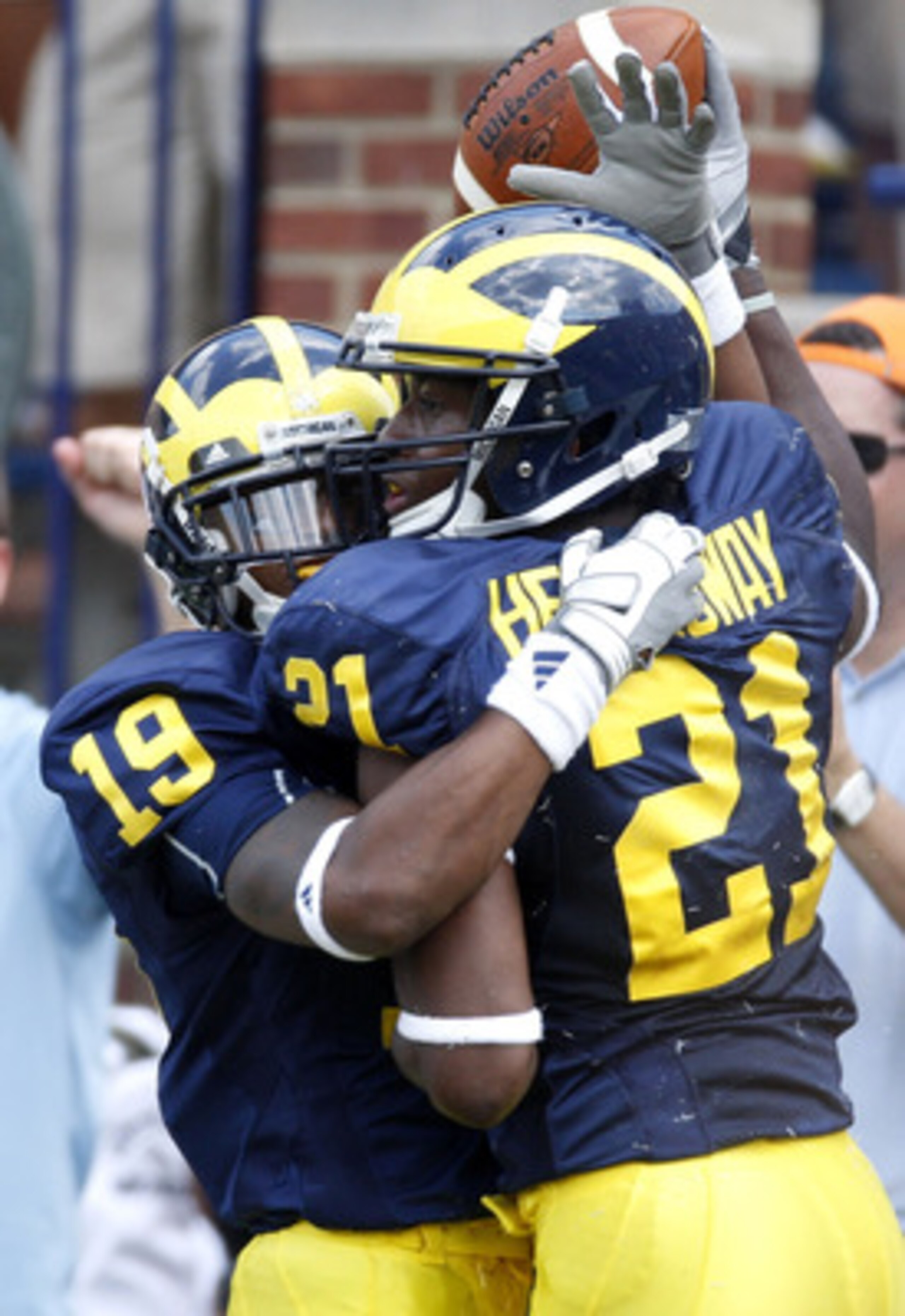 ANN ARBOR, MI - SEPTEMBER 05: Junior Hemingway #21 of the Michigan Wolverines celebrates a first quarter touchdown with Kelvin Grady #19 while playing the Western Michigan Broncos on September 5, 2009 at Michigan Stadium in Ann Arbor, Michigan.  (Photo by