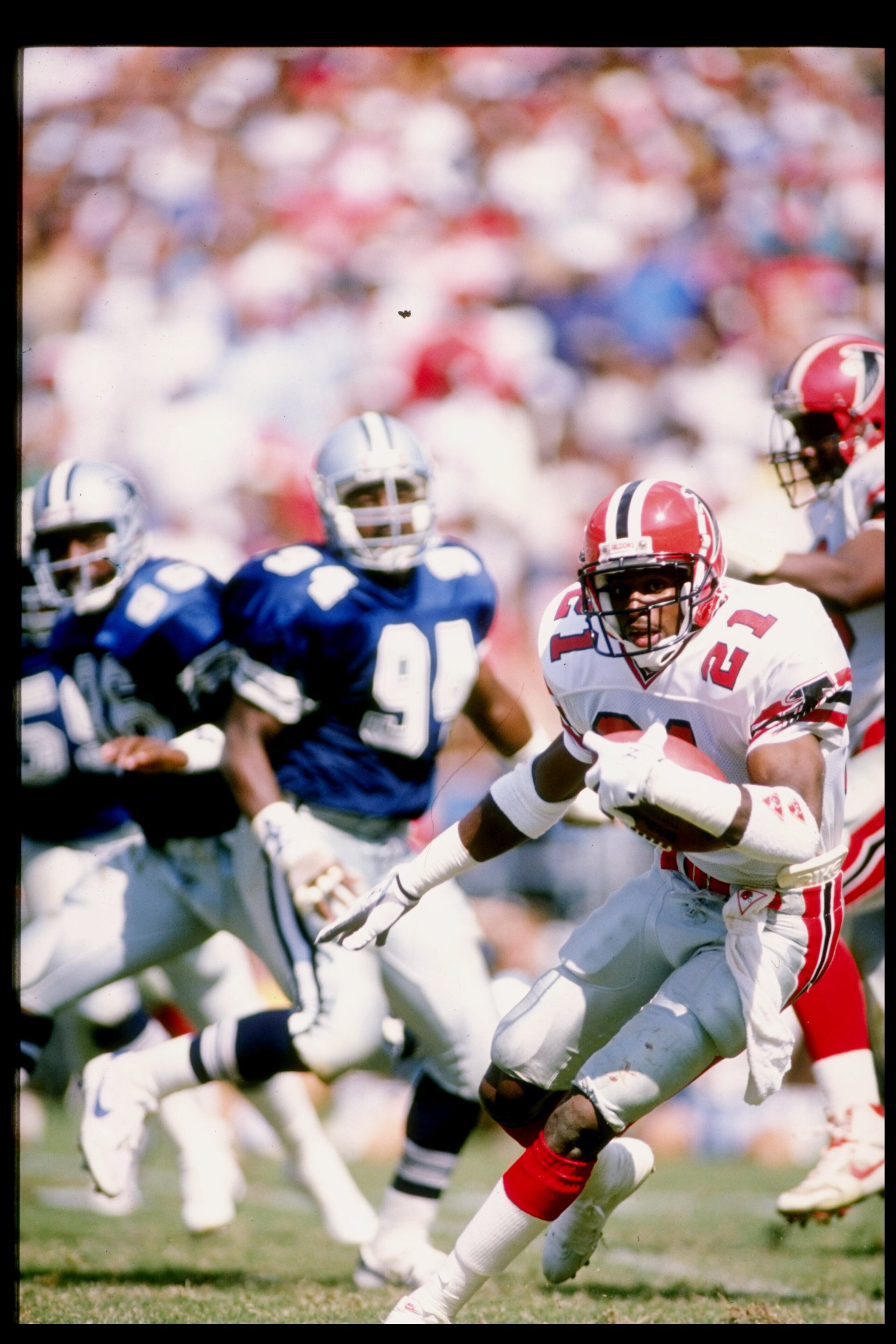 1989:  Defensive back Deion Sanders of the Atlanta Falcons runs with the football during a game against the Dallas Cowboys at Fulton County Stadium in Atlanta, Georgia.  The Falcons won the game 27-21. Mandatory Credit: Allen Steele  /Allsport