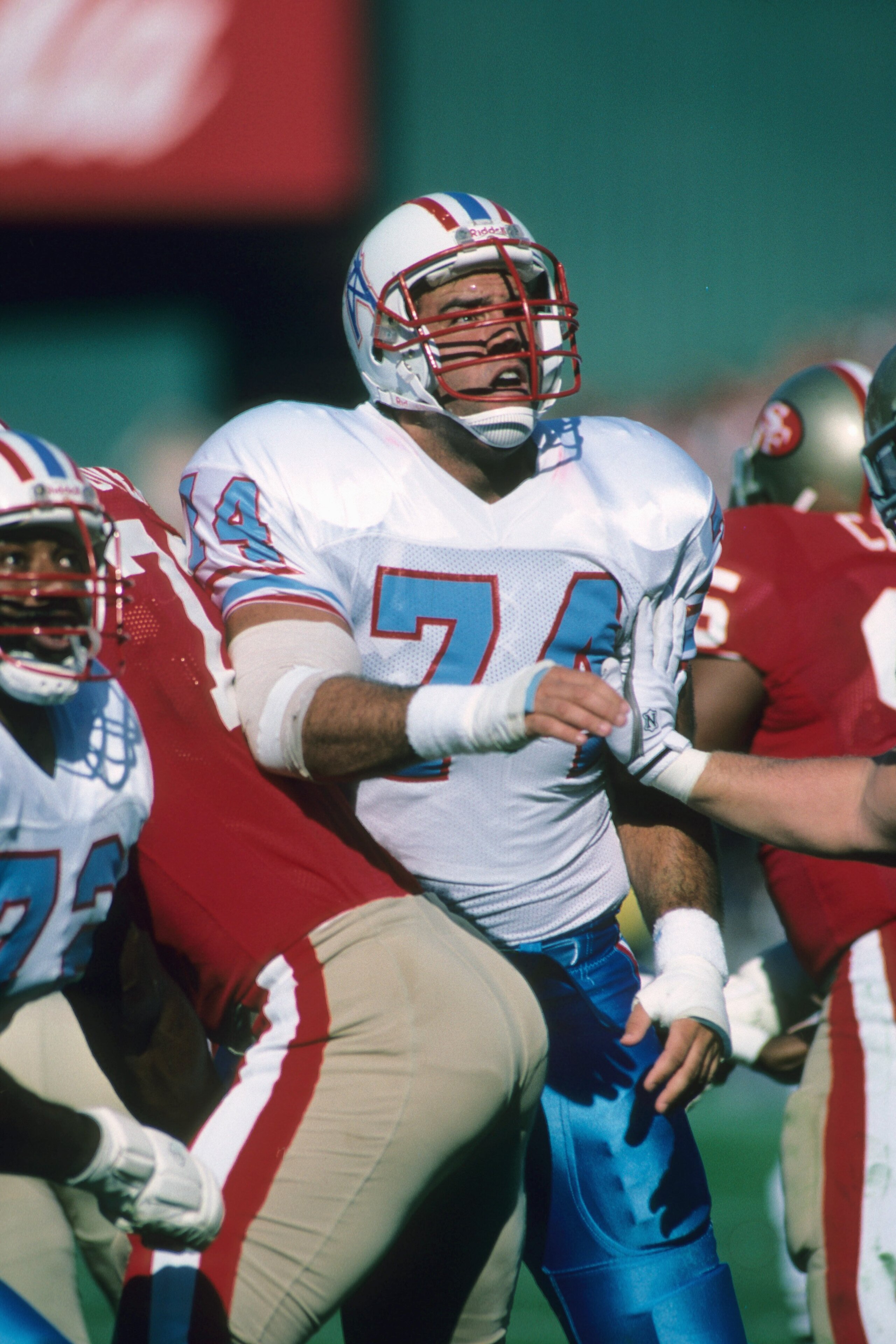 SAN FRANCISCO - NOVEMBER 8:  Guard Bruce Matthews #74 of the Houston Oilers blocks against the San Francisco 49ers defense during a game at Candlestick Park on November 8, 1987 in San Francisco, California.  The 49ers won 27-20.  (Photo by George Rose/Get