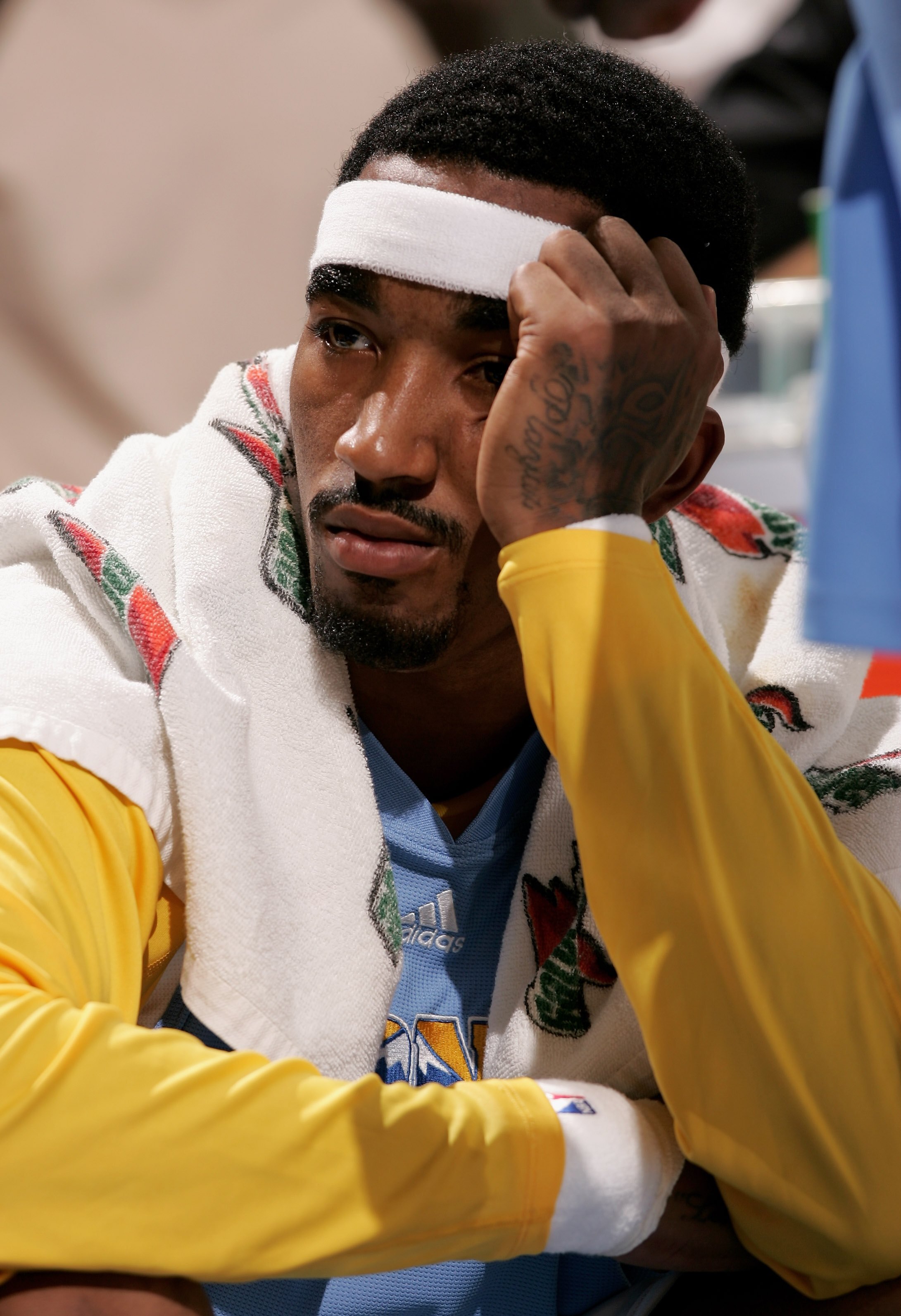 DENVER - NOVEMBER 03:  J.R. Smith #1 of the Denver Nuggets sits on the bench as the Minnesota Timberwolves defeated the Nuggets 112-109 on November 3, 2006 at the Pepsi Center in Denver, Colorado. NOTE TO USER: User expressly acknowledges and agrees that,