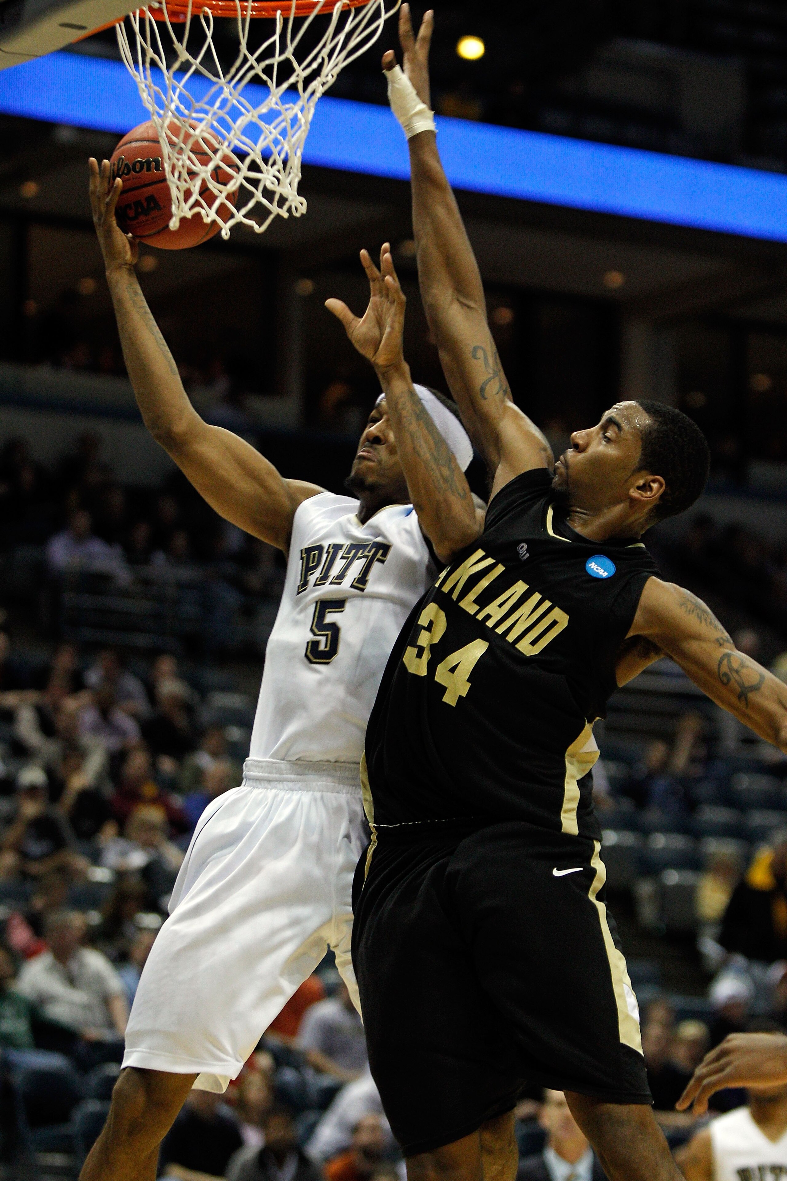 MILWAUKEE - MARCH 19: Gilbert Brown #5 of the Pittsburgh Panthers goes up for a shot against Keith Benson #34 of the Oakland Golden Grizzlies during the first round of the 2010 NCAA men's basketball tournament at the Bradley Center on March 19, 2010 in M MILWAUKEE - MARCH 19: Gilbert Brown #5 of the Pittsburgh Panthers goes up for a shot against Keith Benson #34 of the Oakland Golden Grizzlies during the first round of the 2010 NCAA men's basketball tournament at the Bradley Center on March 19, 2010 in M