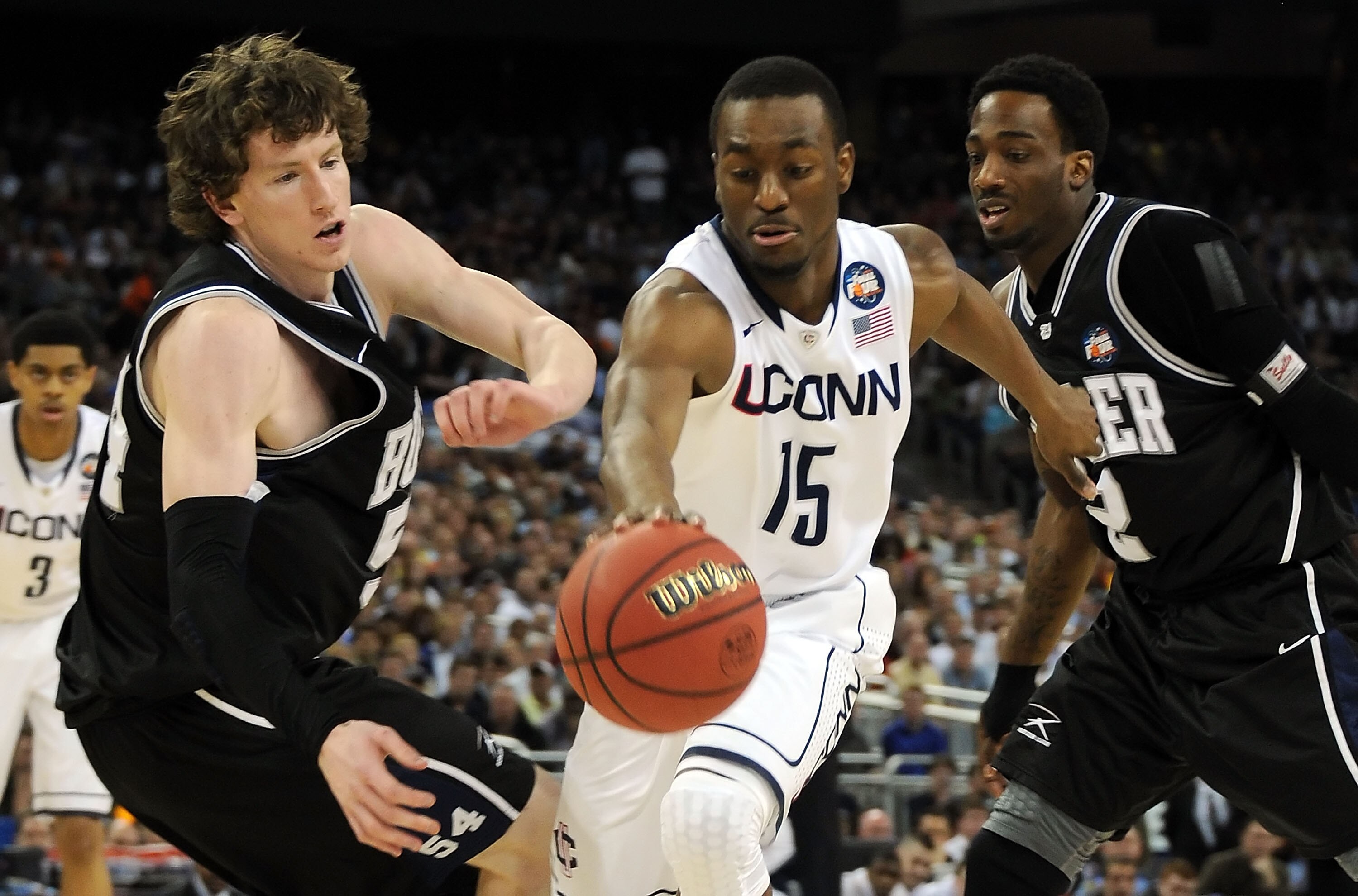 HOUSTON, TX - APRIL 04:  Kemba Walker #15 of the Connecticut Huskies fights for the ball against Matt Howard #54 and Shawn Vanzant #2 of the Butler Bulldogs during the National Championship Game of the 2011 NCAA Division I Men's Basketball Tournament at R