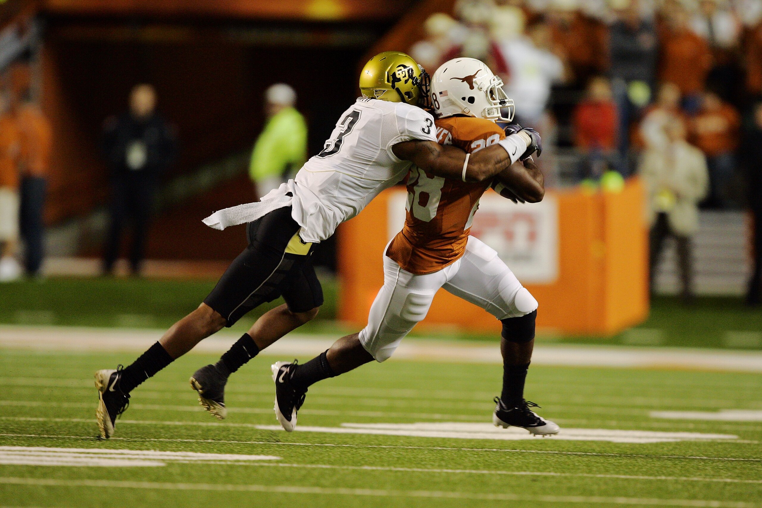 AUSTIN, TX - OCTOBER 10:  Running back Fozzy Whittaker #28 of the Texas Longhorns carries the ball against cornerback Jimmy Smith #3 of the Colorado Buffaloes on October 10, 2009 at Darrell K Royal-Texas Memorial Stadium in Austin, Texas.  Texas won 38-14