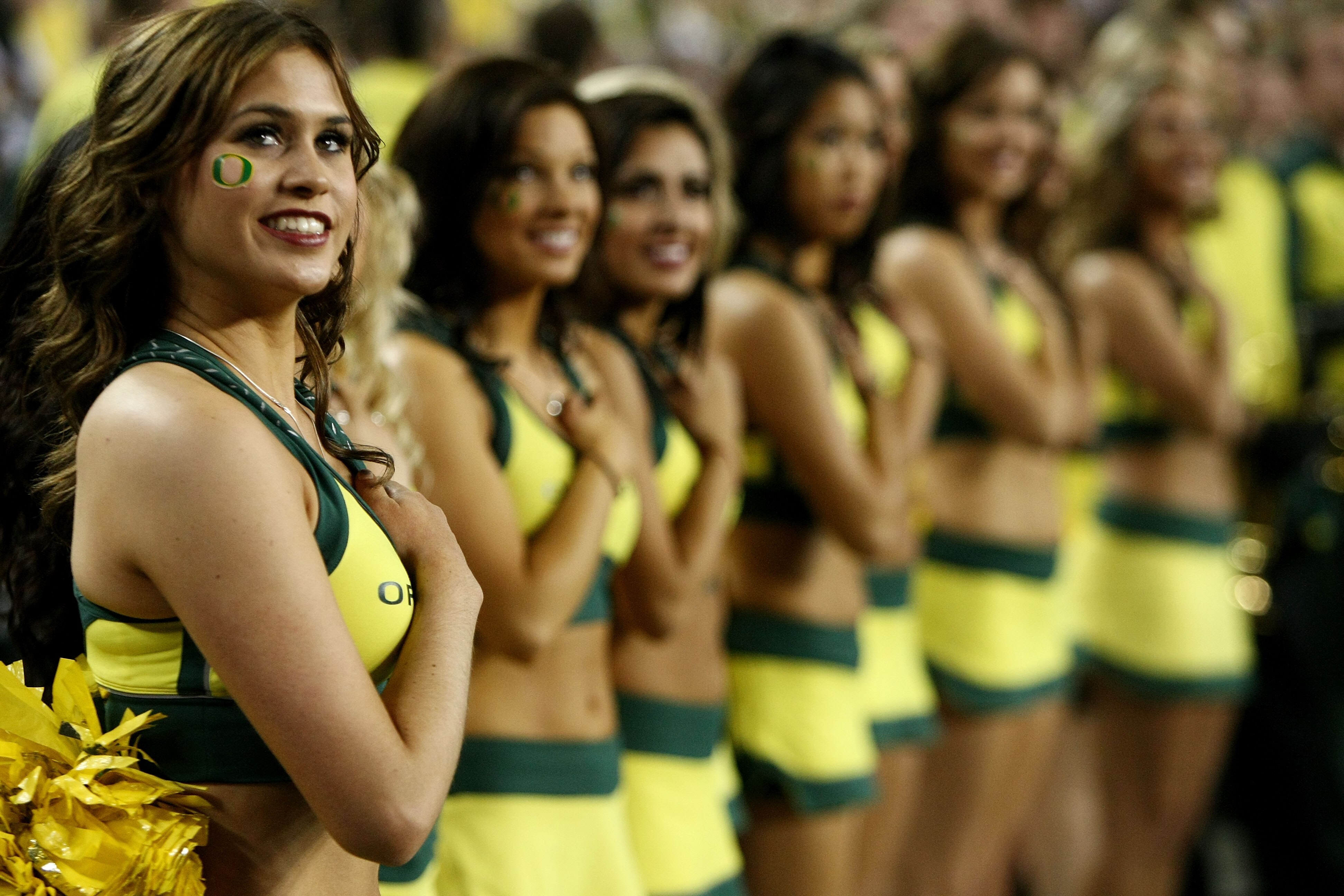 GLENDALE, AZ - JANUARY 10:  The Oregon Ducks cheerleaders performs before taking on the Auburn Tigers in the Tostitos BCS National Championship Game at University of Phoenix Stadium on January 10, 2011 in Glendale, Arizona.  (Photo by Jonathan Ferrey/Gett