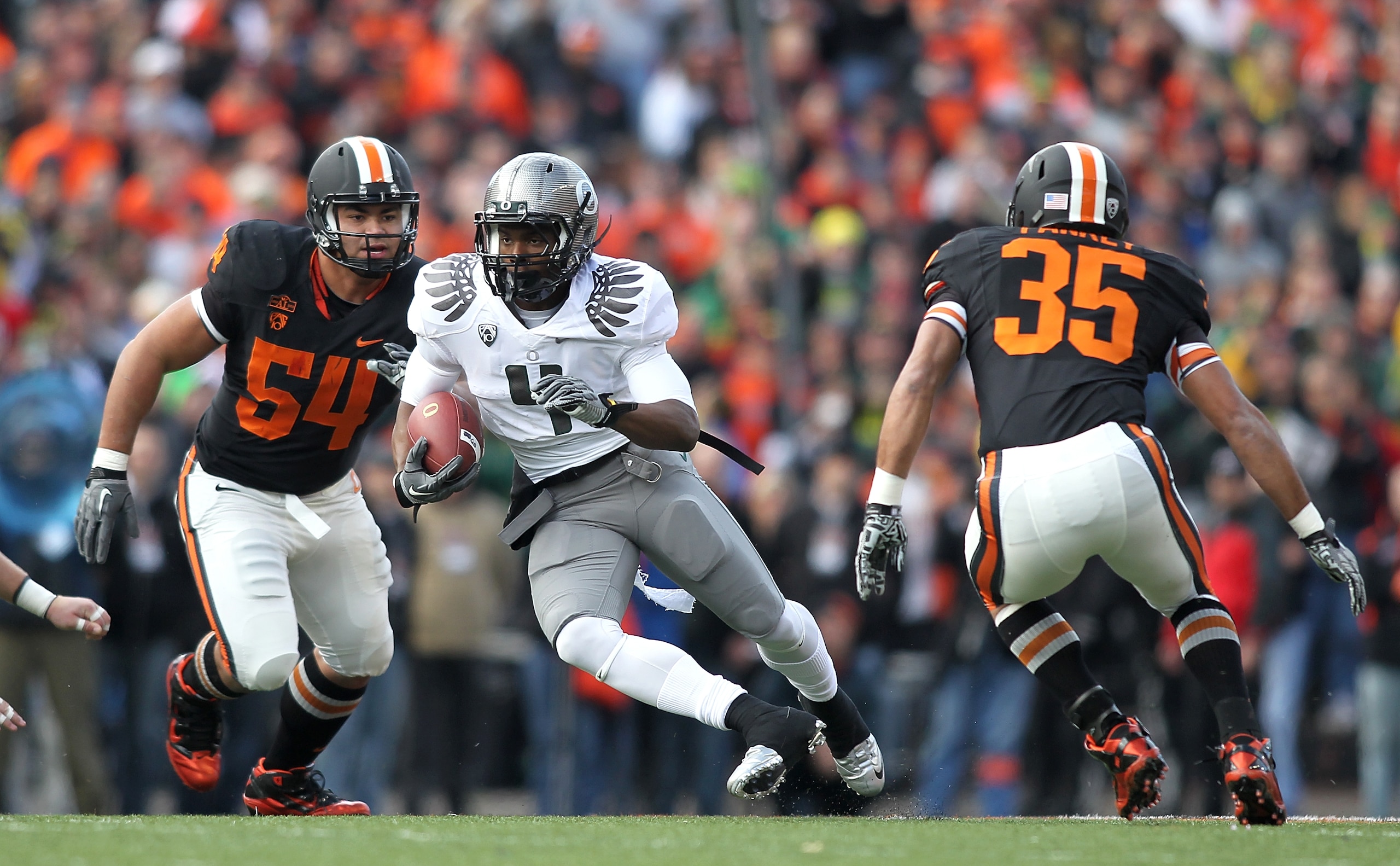 CORVALLIS, OR - DECEMBER 04: Josh Huff #4 of the Oregon Ducks runs te ball against Keith Pankey #35 of the Oregon State Beavers during the 114th Civil War on December 4, 2010 at the Reser Stadium in Corvallis, Oregon. (Photo by Jonathan Ferrey/Getty Ima CORVALLIS, OR - DECEMBER 04: Josh Huff #4 of the Oregon Ducks runs te ball against Keith Pankey #35 of the Oregon State Beavers during the 114th Civil War on December 4, 2010 at the Reser Stadium in Corvallis, Oregon. (Photo by Jonathan Ferrey/Getty Ima