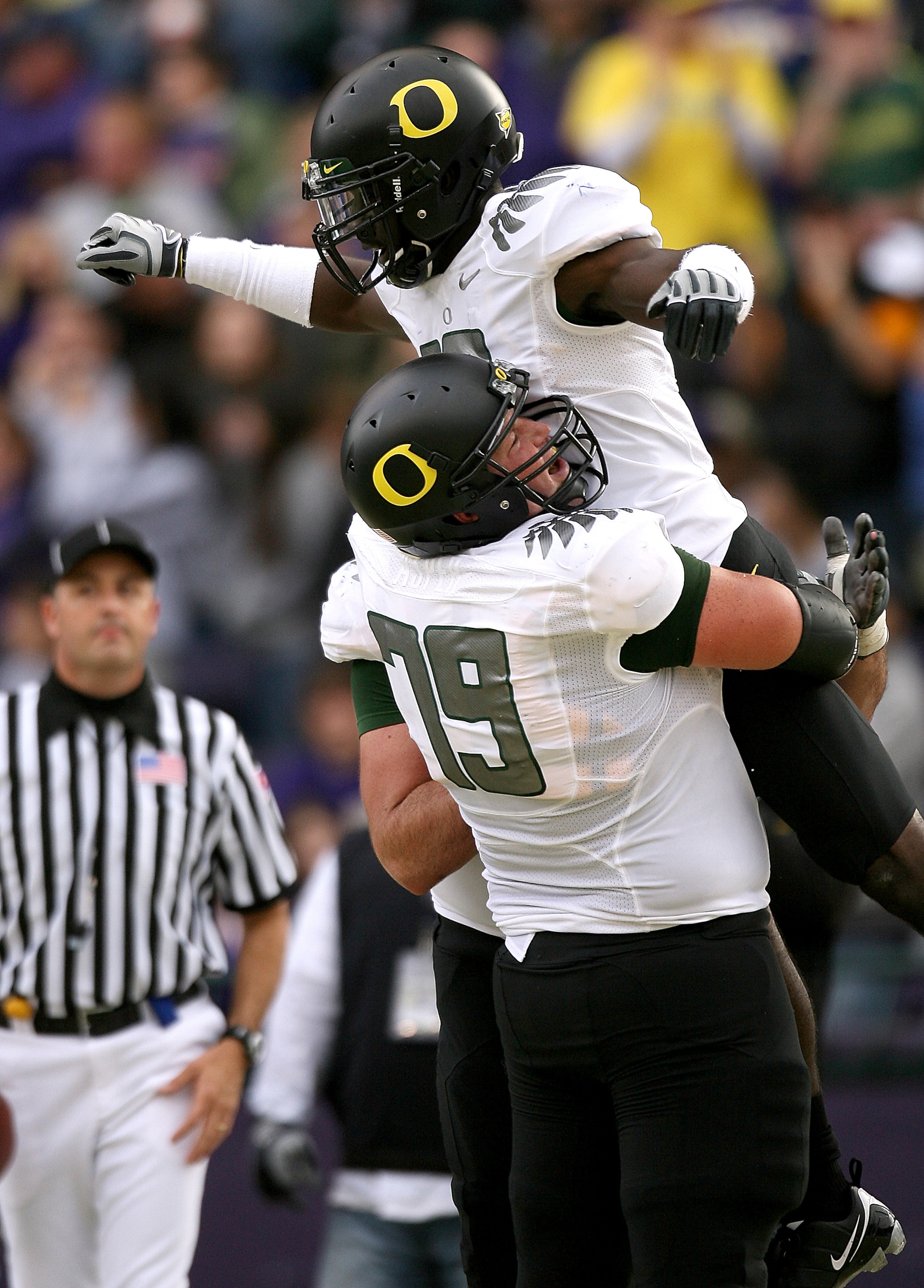 SEATTLE - OCTOBER 24: Wide receiver D.J. Davis #10 of the Oregon Ducks celebrates with Mark Asper #79 after scoring a touchdown against the Washington Huskies on October 24, 2009 at Husky Stadium in Seattle, Washington. The Ducks defeated the Huskies 43- SEATTLE - OCTOBER 24: Wide receiver D.J. Davis #10 of the Oregon Ducks celebrates with Mark Asper #79 after scoring a touchdown against the Washington Huskies on October 24, 2009 at Husky Stadium in Seattle, Washington. The Ducks defeated the Huskies 43-
