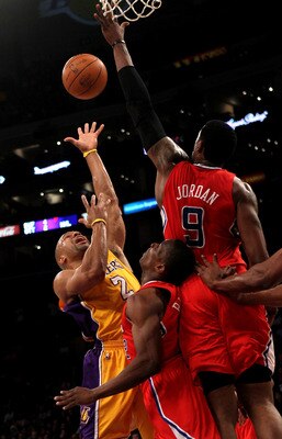 LOS ANGELES, CA - FEBRUARY 25:  Derek Fisher#2 of the Los Angeles Lakers shoots against DeAndre Jordan #9 and Eric Bledsoe #12 of the Los Angeles Clippers at Staples Center on February 25, 2011 in Los Angeles, California. The Lakers won 108-95.  NOTE TO U