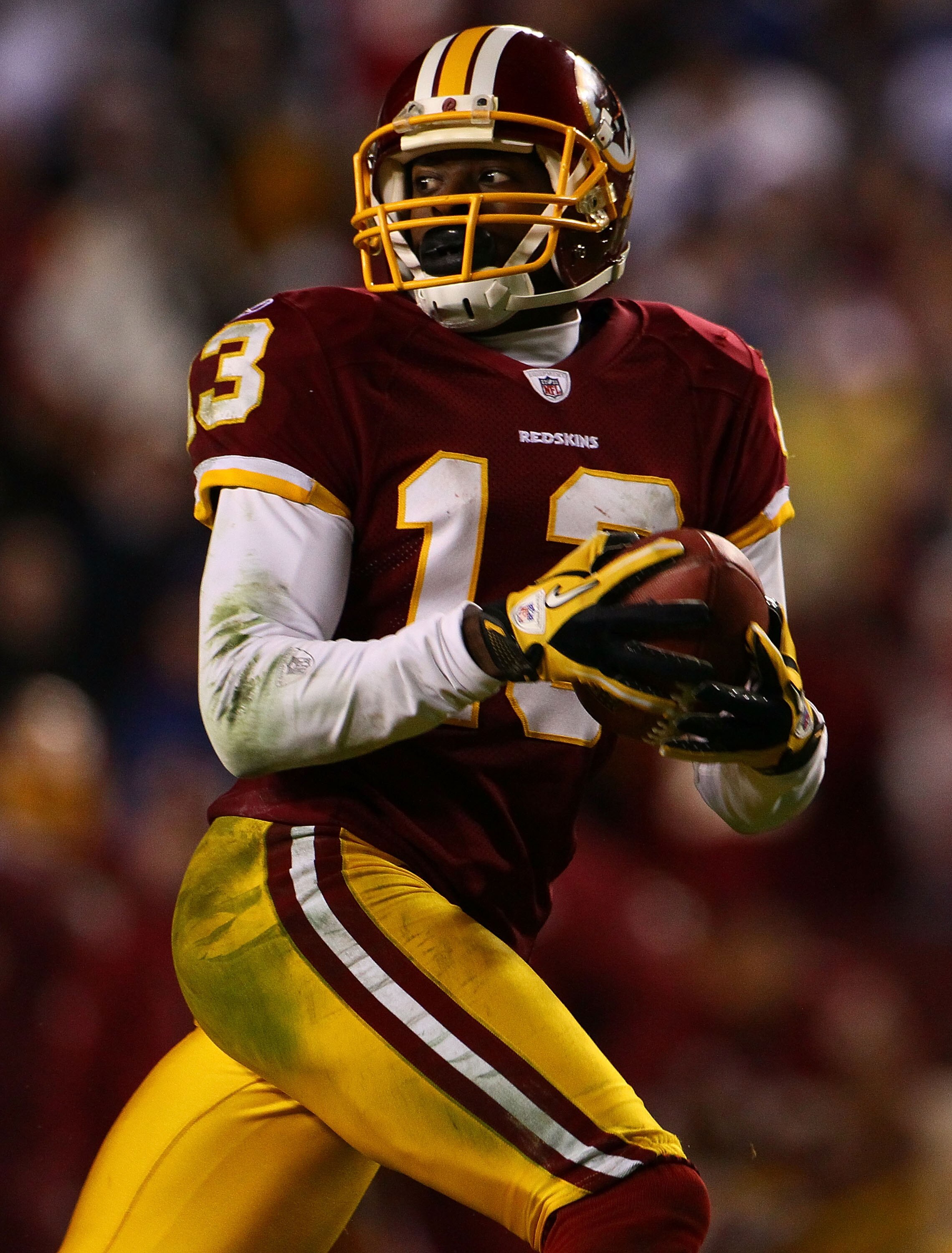 LANDOVER, MD - JANUARY 02:  Wide receiver Anthony Armstrong #13 of the Washington Redskins catches a touchdown pass against the New York Giants during a game at FedEx Field on January 2, 2011 in Landover, Maryland. The Giants won the game 17-14.  (Photo b