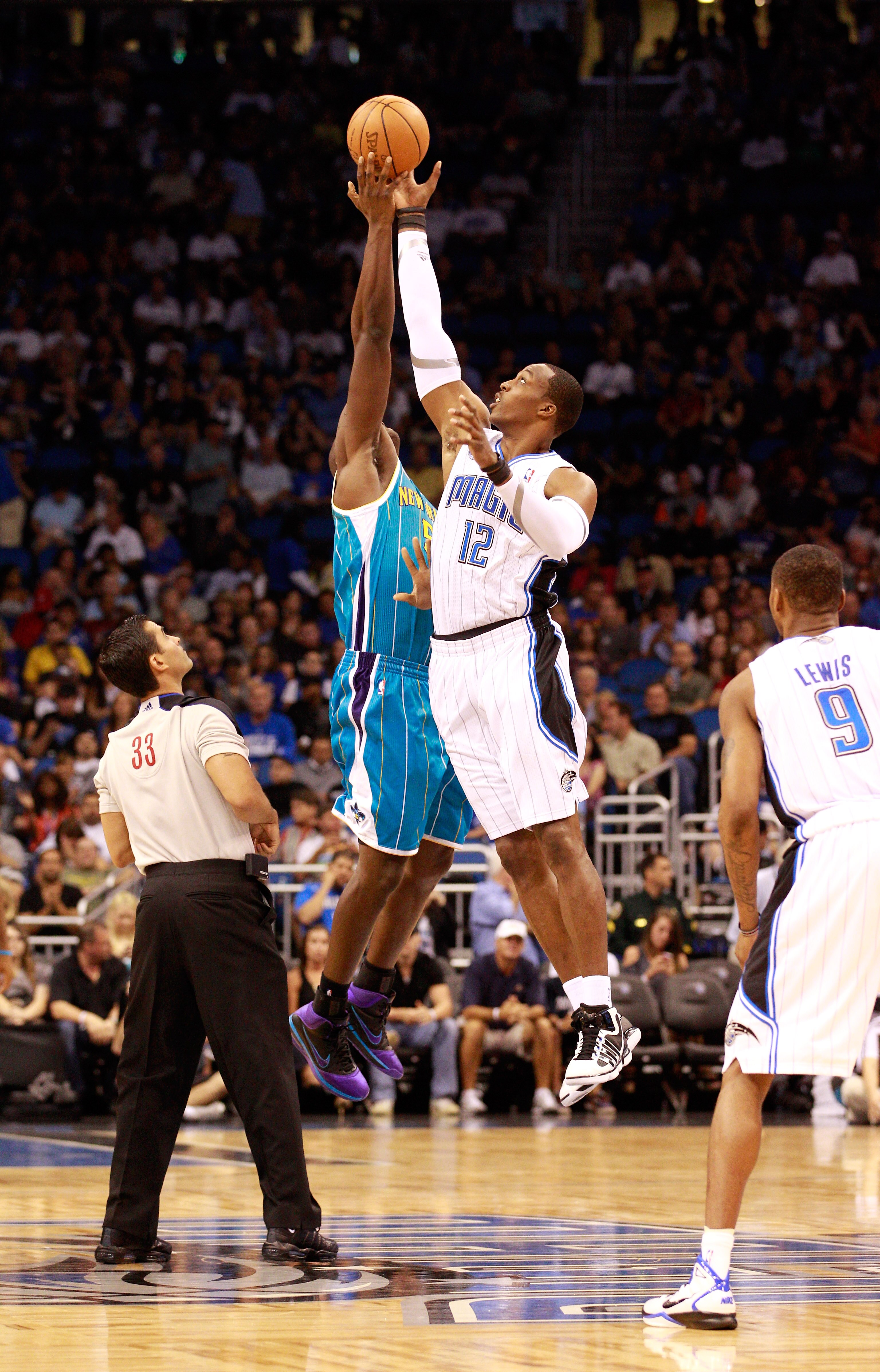 ORLANDO, FL - OCTOBER 10: Dwight Howard #12 of the Orlando Magic jumps against Emeka Okafor #50 of the New Orleans Hornets during the game at Amway Arena on October 10, 2010 in Orlando, Florida. NOTE TO USER: User expressly acknowledges and agrees that, ORLANDO, FL - OCTOBER 10: Dwight Howard #12 of the Orlando Magic jumps against Emeka Okafor #50 of the New Orleans Hornets during the game at Amway Arena on October 10, 2010 in Orlando, Florida. NOTE TO USER: User expressly acknowledges and agrees that,
