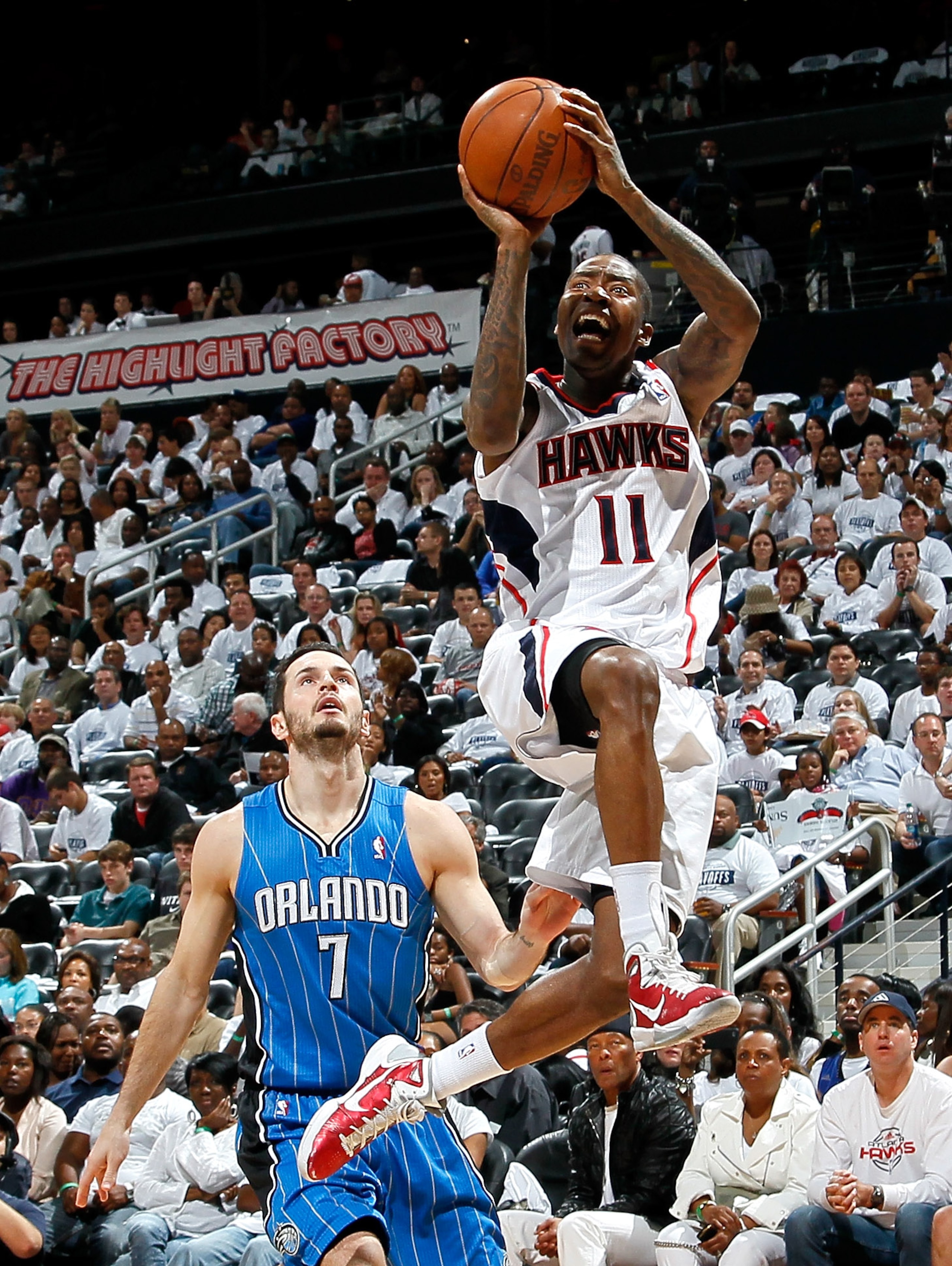 ATLANTA, GA - APRIL 22:  Jamal Crawford #11 of the Atlanta Hawks shoots against J.J. Redick #7 of the Orlando Magic during Game Three of the Eastern Conference Quarterfinals in the 2011 NBA Playoffs at Philips Arena on April 22, 2011 in Atlanta, Georgia.