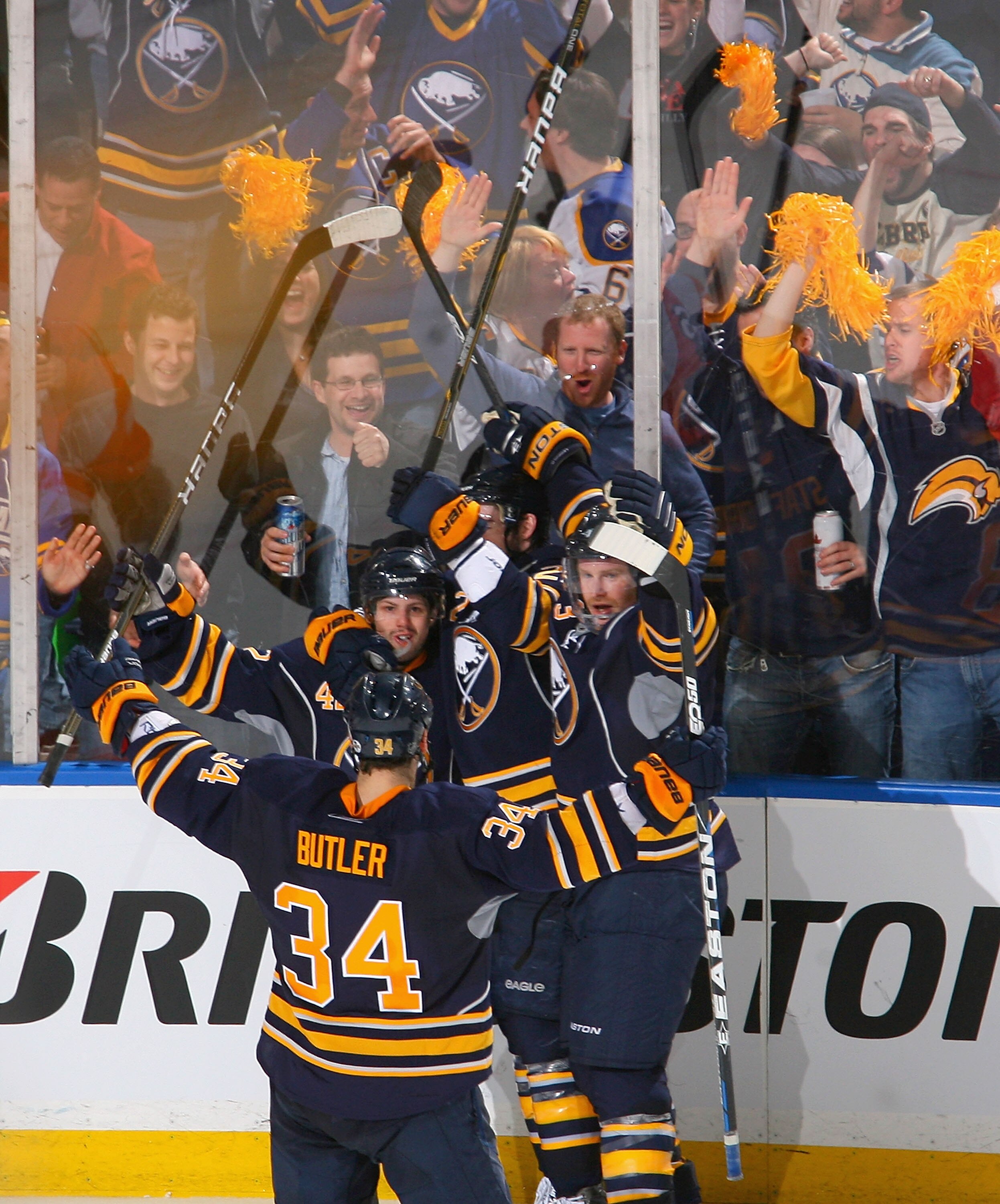BUFFALO, NY - APRIL 24: Nathan Gerbe #42 (left facing) of the Buffalo Sabres celebrates with teammates after scoring Bufffalo's fourth goal against the Philadelphia Flyers in Game Six of the Eastern Conference Quarterfinals during the 2011 NHL Stanley Cup