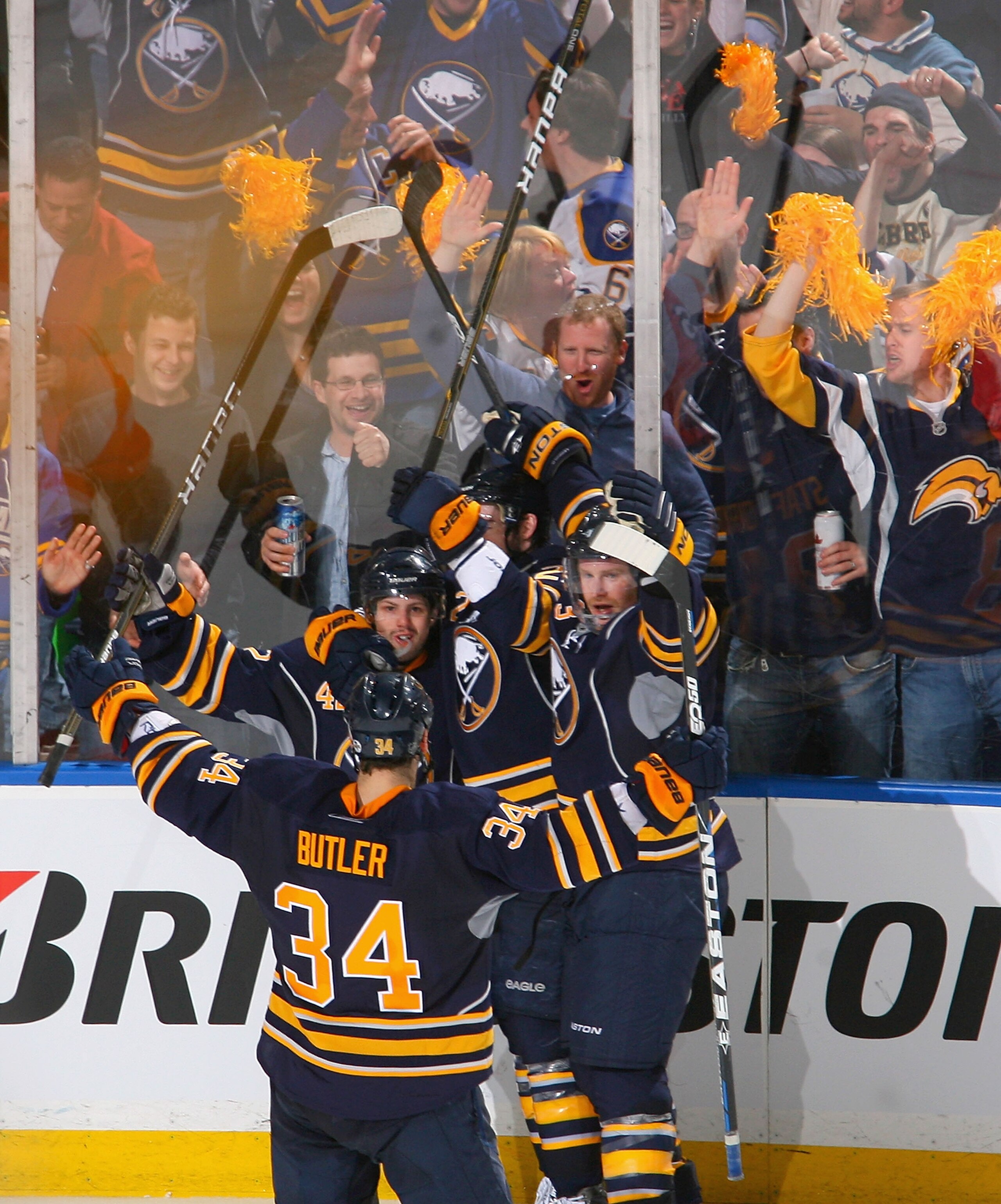 BUFFALO, NY - APRIL 24: Nathan Gerbe #42 (left facing) of the Buffalo Sabres celebrates with teammates after scoring Bufffalo's fourth goal against the Philadelphia Flyers in Game Six of the Eastern Conference Quarterfinals during the 2011 NHL Stanley Cup