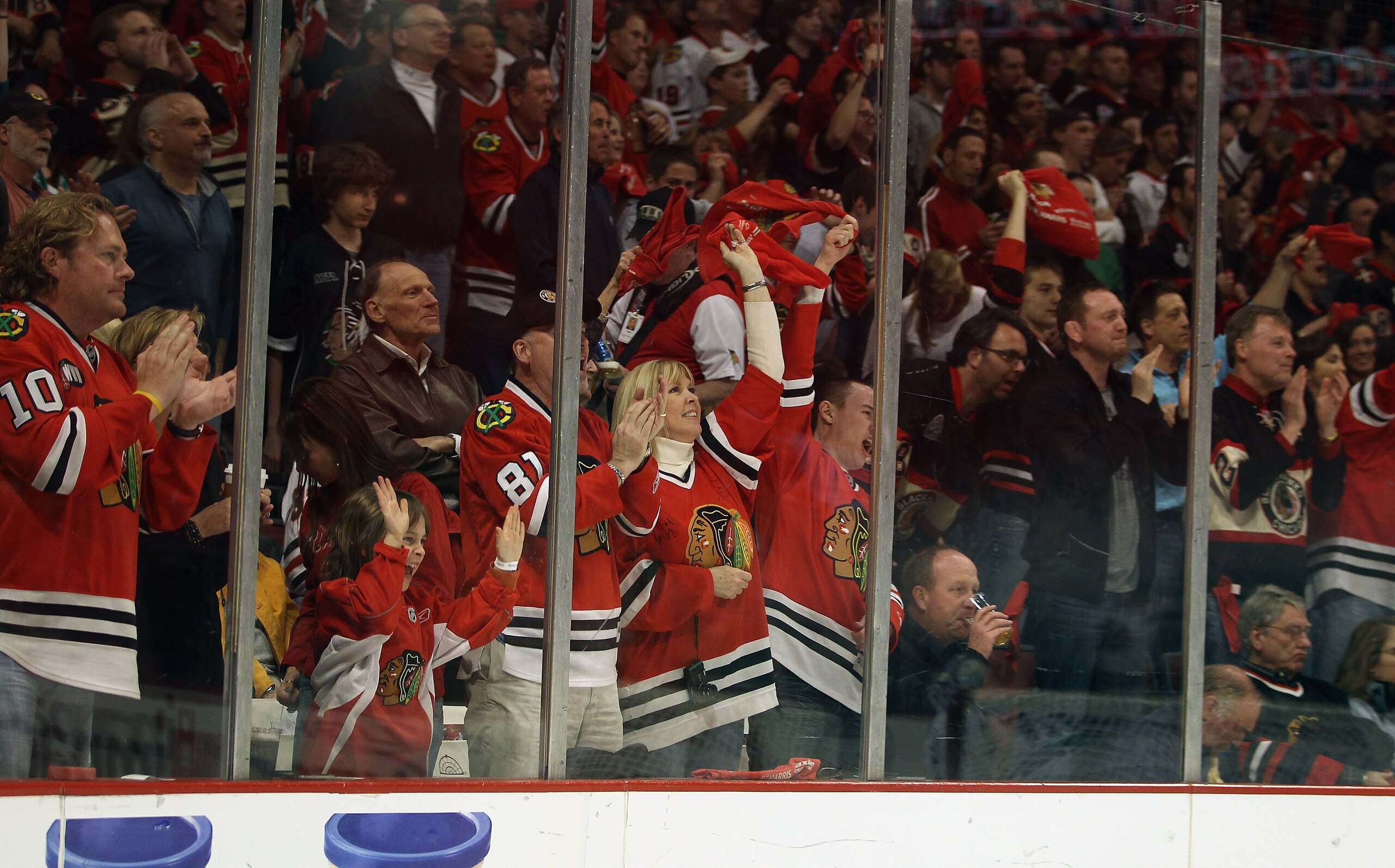 CHICAGO, IL - APRIL 24: Fans of the Chicago Blackhawks cheer a goal against of the Vancouver Canucks in Game Six of the Western Conference Quarterfinals during the 2011 NHL Stanley Cup Playoffs at the United Center on April 24, 2011 in Chicago, Illinois.