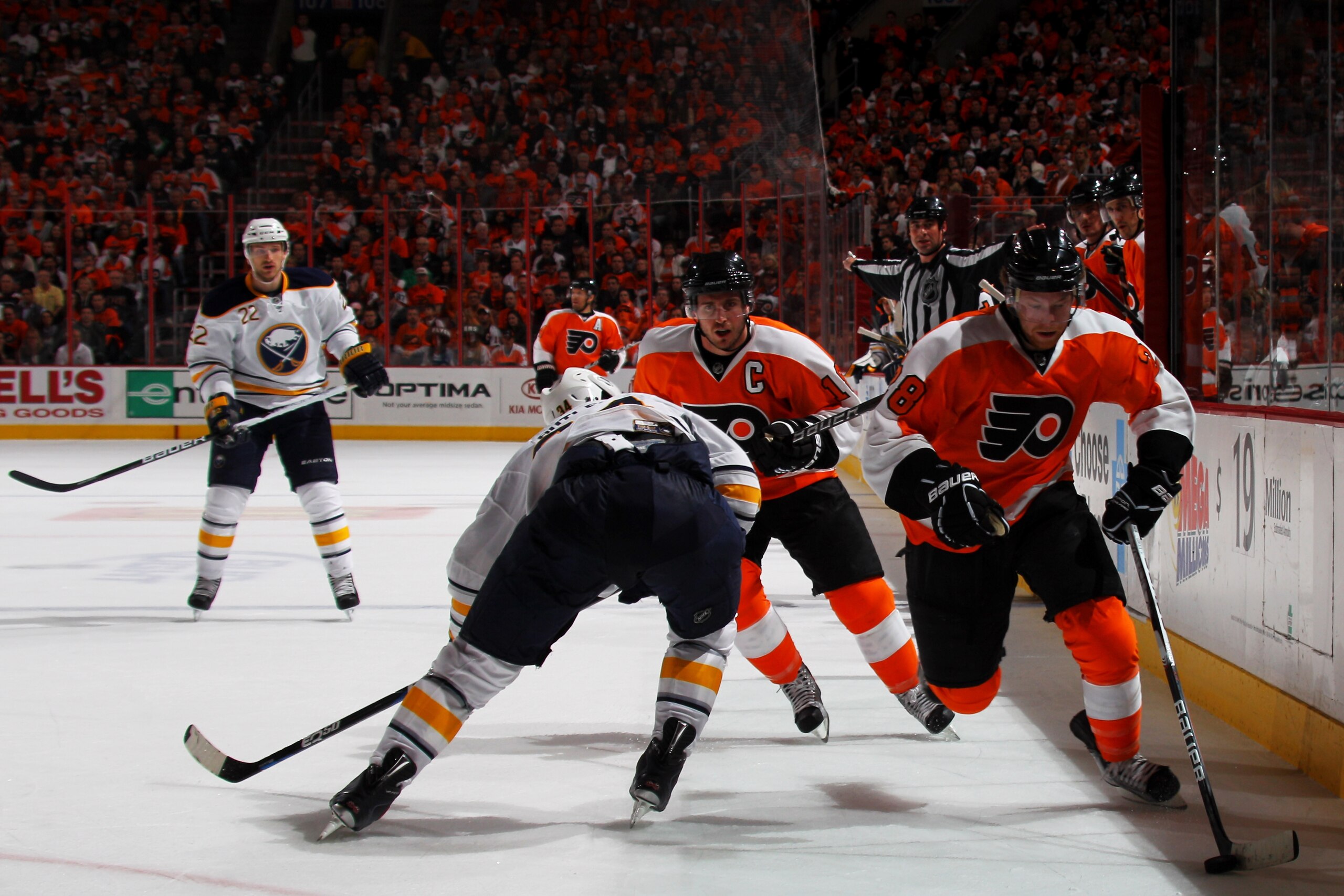 PHILADELPHIA, PA - APRIL 22: Claude Giroux #28 of the Philadelphia Flyers controls the puck against Chris Butler #34 of the Buffalo Sabres in Game Five of the Eastern Conference Quarterfinals during the 2011 NHL Stanley Cup Playoffs at Wells Fargo Center