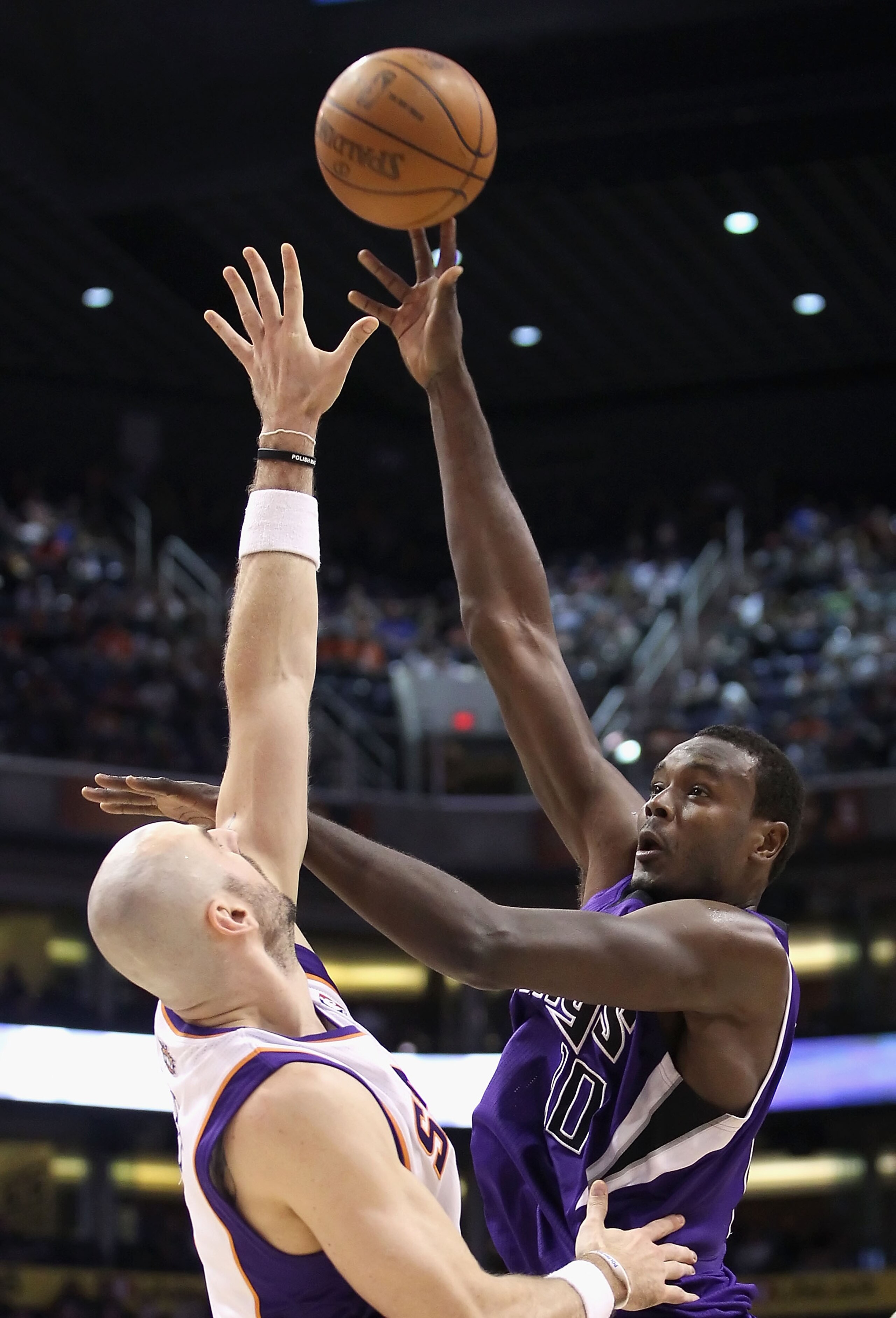 PHOENIX, AZ - FEBRUARY 13: Samuel Dalembert #10 of the Sacramento Kings puts up a shot over Marcin Gortat #4 of the Phoenix Suns during the NBA game at US Airways Center on February 13, 2011 in Phoenix, Arizona. The Kings defeated the Suns 113-108. NOTE PHOENIX, AZ - FEBRUARY 13: Samuel Dalembert #10 of the Sacramento Kings puts up a shot over Marcin Gortat #4 of the Phoenix Suns during the NBA game at US Airways Center on February 13, 2011 in Phoenix, Arizona. The Kings defeated the Suns 113-108. NOTE
