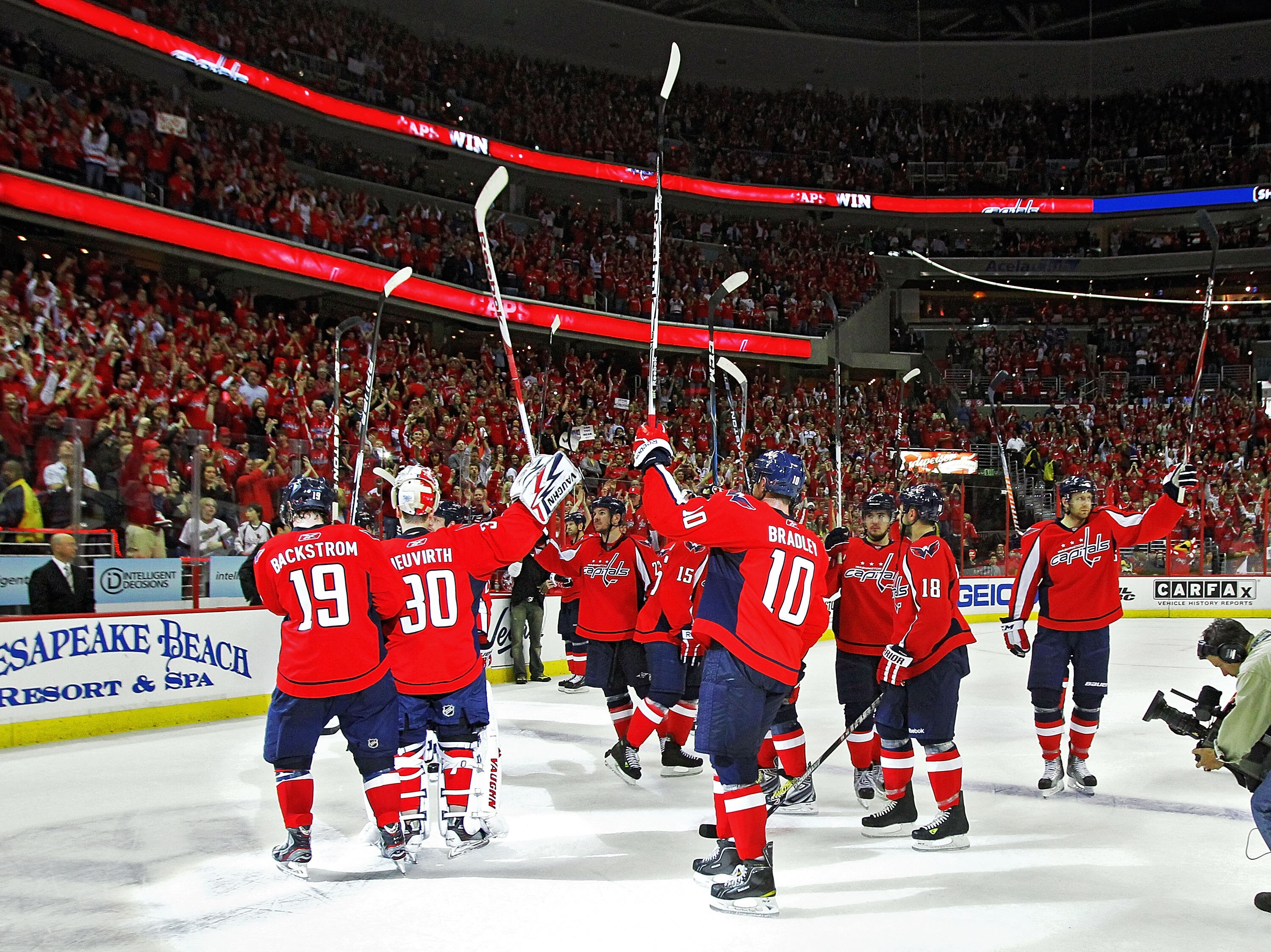 WASHINGTON, DC - APRIL 23:  Members of the Washington Capitals salute their fans as they defeated the New York Rangers 3-1 in Game Five of the Eastern Conference Quarterfinals during the 2011 NHL Stanley Cup Playoffs at the Verizon Center on April 23, 201