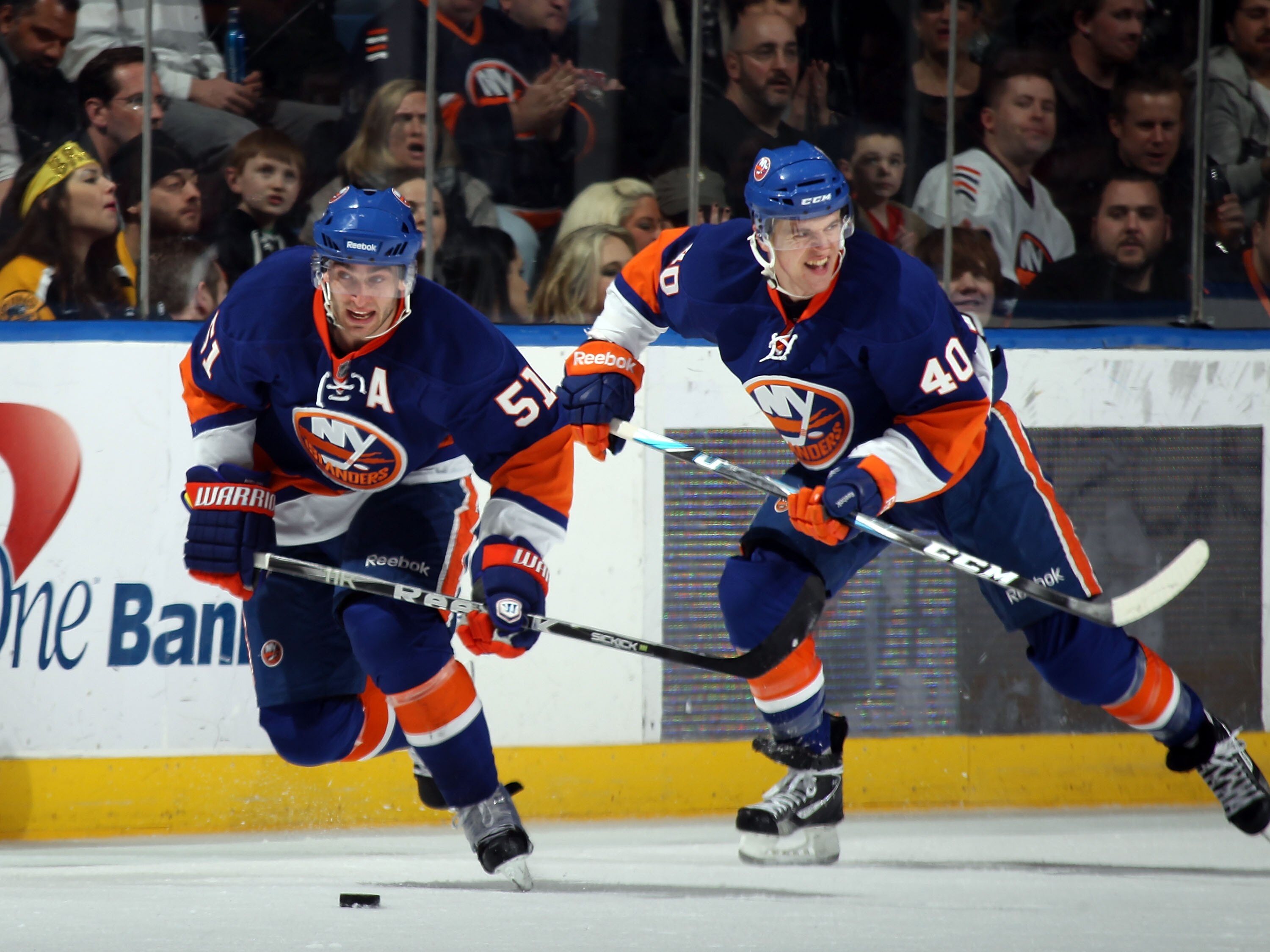 UNIONDALE, NY - MARCH 11: Frans Nielsen #51 and Michael Grabner #40 of the New York Islanders skate against the Boston Bruins at the Nassau Coliseum on March 11, 2011 in Uniondale, New York.  (Photo by Bruce Bennett/Getty Images)