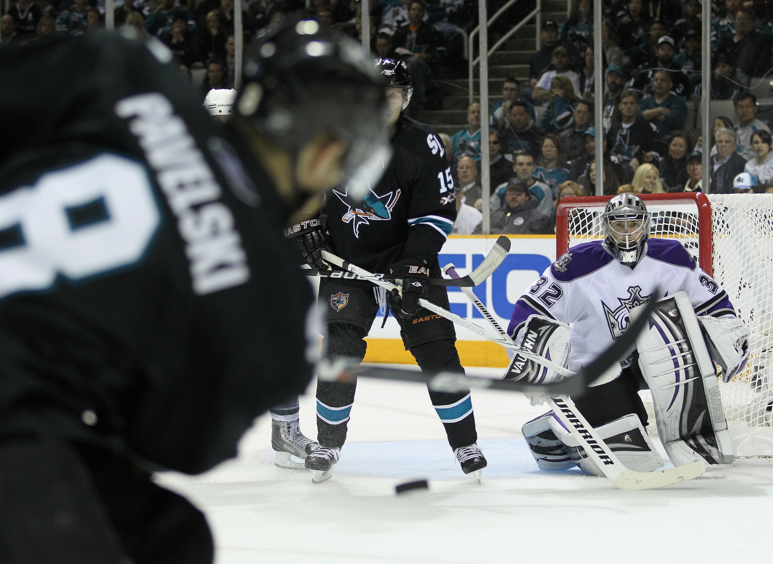 SAN JOSE, CA - APRIL 23:  Jonathan Quick #32 of the Los Angeles Kings keeps his eyes on a shot taken by Joe Pavelski #8 of the San Jose Sharks in game five of the Western Conference Quarterfinals during the 2011 NHL Stanley Cup Playoffs at HP Pavilion on