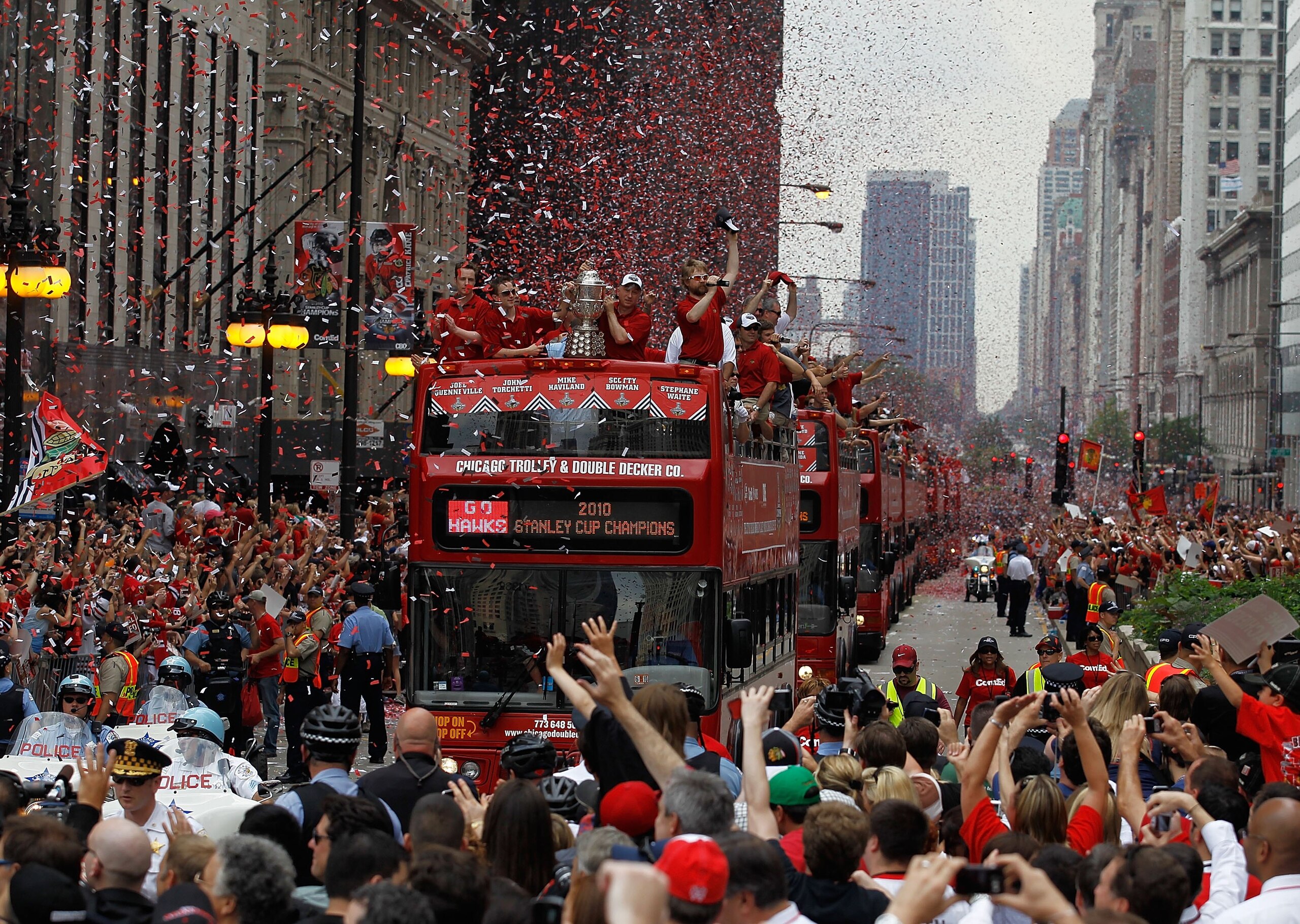 CHICAGO - JUNE 11: Buses carrying members of the Chicago Blackhawks players, staff and families make their way down Michigan Avenue during the Chicago Blackhawks Stanley Cup victory parade and rally on June 11, 2010 in Chicago, Illinois. (Photo by Jonatha CHICAGO - JUNE 11: Buses carrying members of the Chicago Blackhawks players, staff and families make their way down Michigan Avenue during the Chicago Blackhawks Stanley Cup victory parade and rally on June 11, 2010 in Chicago, Illinois. (Photo by Jonatha