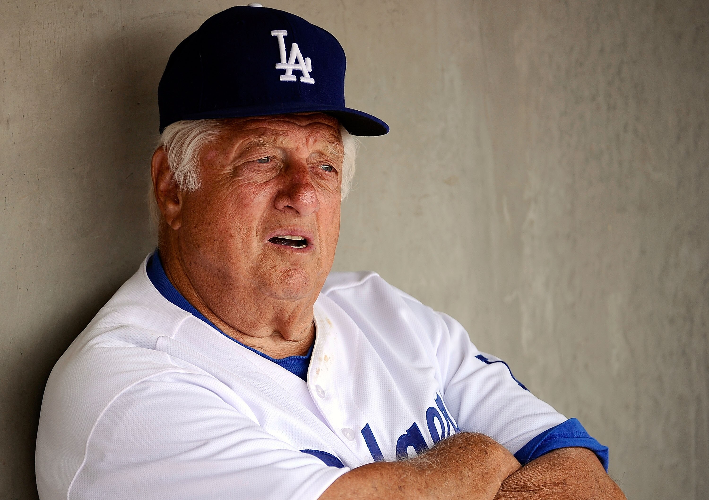 GLENDALE, AZ - MARCH 15:  Hall of Fame manager Tommy Lasorda #2 of the Los Angeles Dodgers sits in the dugout prior to the start of the spring training baseball game against the Texas Rangers at Camelback Ranch on March 15, 2011 in Glendale, Arizona.  (Ph