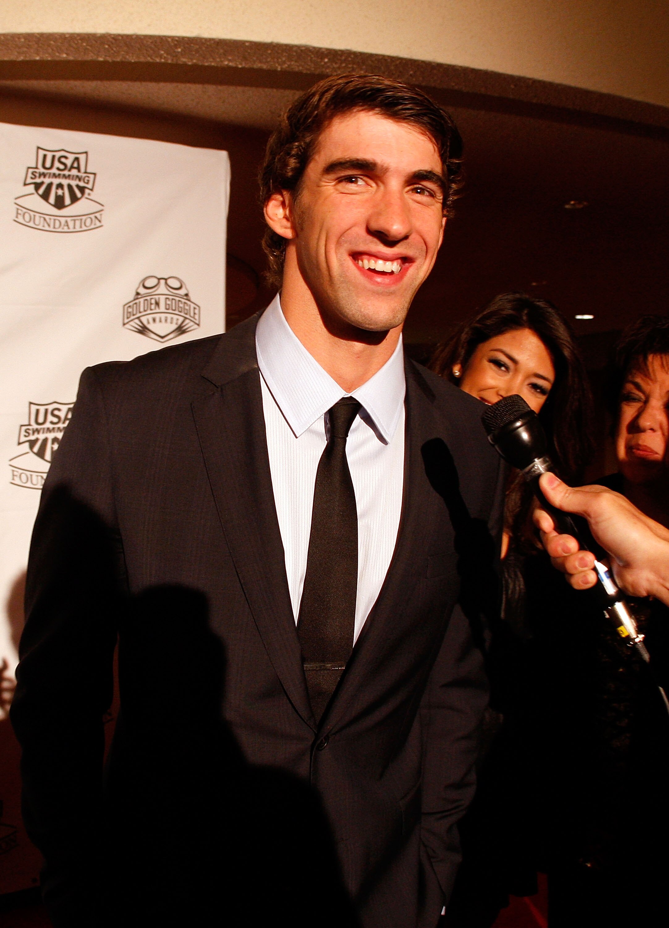 NEW YORK - NOVEMBER 22:  Michael Phelps of the U.S. National Swim Team speaks to the media on the red carpet prior to the 7th Annual Golden Goggle Awards at the Marriott Marquis on November 22, 2010 in New York City.  (Photo by Mike Stobe/Getty Images)